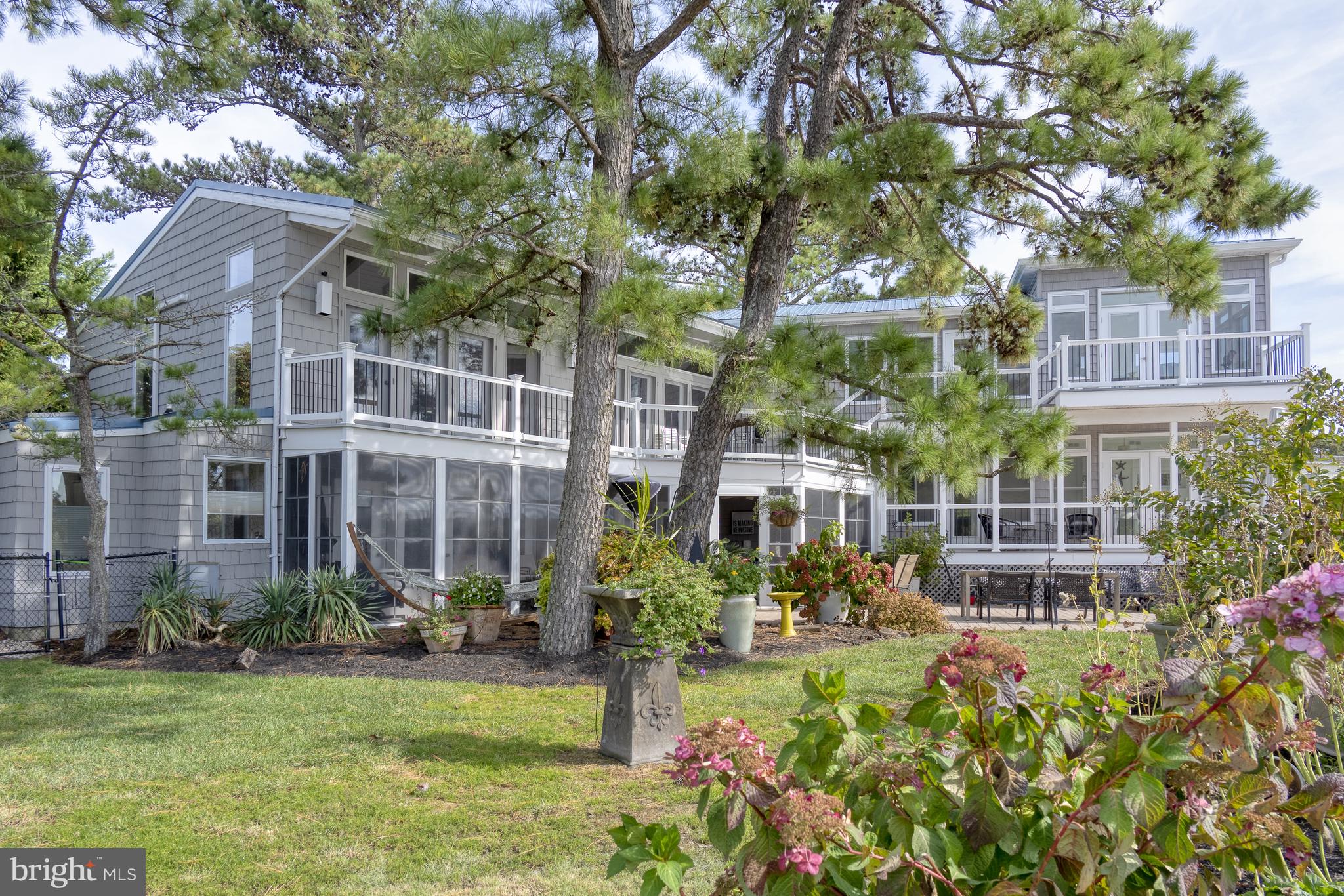 Private WATERFRONT oasis in North Shores. You're captured by the breathtaking views whether you are inside or outside this home.  With seven bedrooms, 5.5 baths, eat-in kitchen and endless porches and decks., there is plenty of space for guests and family. If you want to swim or go boating, the pool and dock are here for you. The community of North Shores offers a private beach, pool, tennis, marina. The home is minutes from Gordon's Pond State Park or the bike trail. You will love the ambiance of this home. This home is under contract effective 5-12-23.
