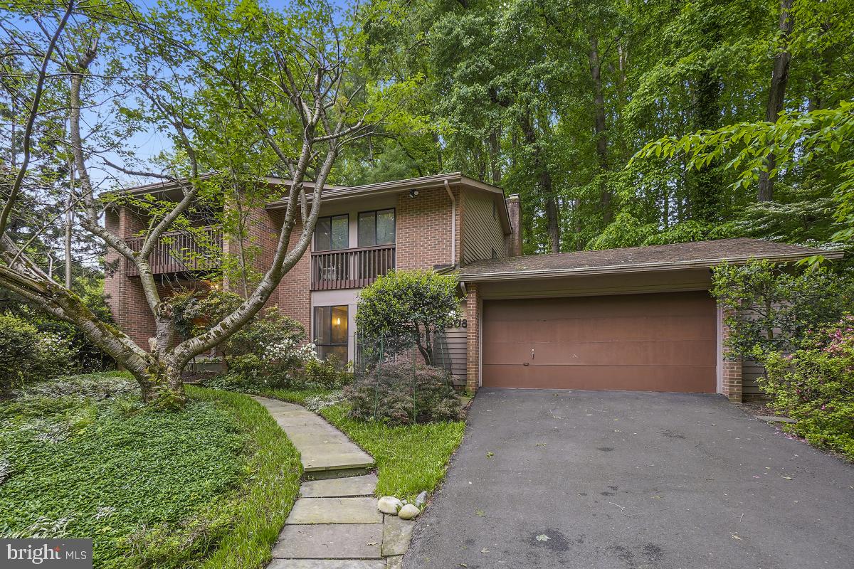 Welcome to 6808 Carlynn Court a Mid Century Modern Split level with five bedrooms, four bathrooms and a two car garage.  Step inside and notice the multiple large windows flooding the home with natural light!  The updated eat in kitchen with stainless appliances and ample storage room is located in the front of the home.  Continue on into the dining room that opens to the living area complete with Cathedral ceilings and a view of the private back yard.   Down to the next level you will discover the family room that include a wet bar, access to the back deck, a bedroom and full bath.  The next level up is where you will find three spacious bedrooms and a hall bath.  The owner's suite has it's own level complete with multiple closets, a spa inspired bath and a separate loft area. The bottom floor has a giant recreation area, laundry, storage and another full bath.  Set in a park like setting just minutes to shopping, restaurants and 495, this house is your perfect new home.
