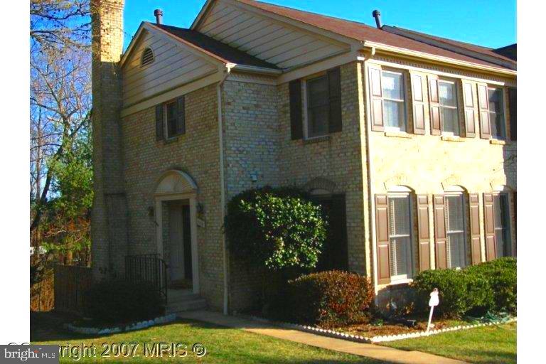 ,Lovely,brick town home; hard wood floors on main level, large country kitchen area, large master suit; finished basement with full bath and walkout to fenced yard with brick patio. Backs to woods for privacy.  2,400 finished sq ft of living area.  Woodson HS, Frost MS, Wakefield Forest ES.