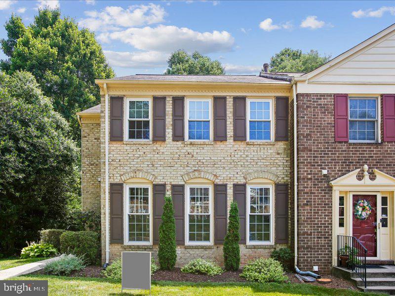 ,Lovely,brick town home; hard wood floors on main level, large country kitchen area, large master suit; finished basement with full bath and walkout to fenced yard with brick patio. Backs to woods for privacy.  2,400 finished sq ft of living area.  Woodson HS, Frost MS, Wakefield Forest ES.