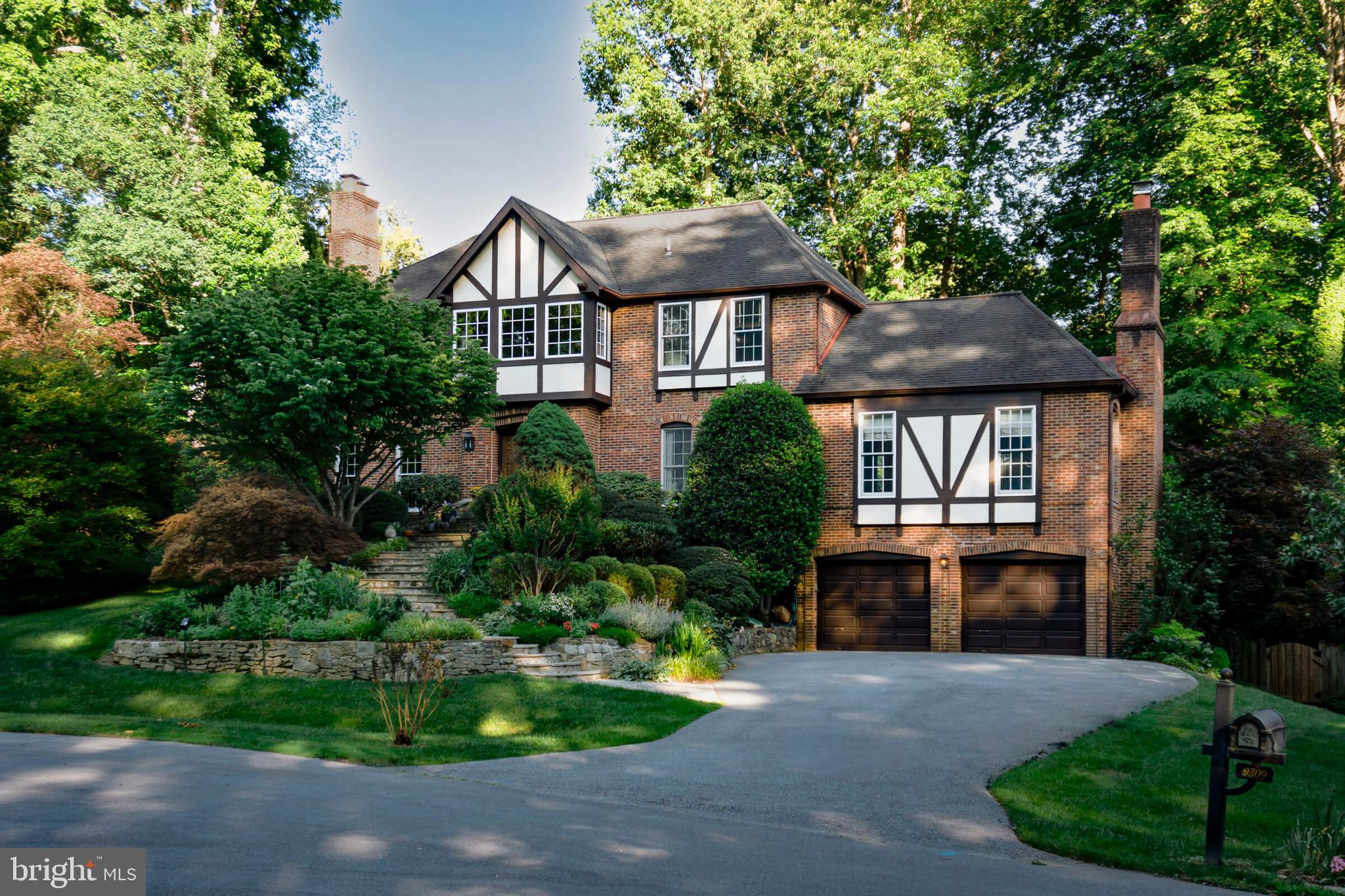 Set atop a picturesque half acre lot with meticulously maintained lush gardens, 9309 Mercy Hollow Lane presents a rare opportunity to own a grand tutor home with a contemporary perspective. Professionally designed and extensively renovated, this sophisticated residence showcases exquisite architectural details with fine craftsmanship throughout.

Stepping into this elegant home, you are greeted by a two-story foyer, setting the tone for the open floor plan that flows seamlessly through the space. The gourmet kitchen balances aesthetics with functionality, complete with an expansive island and stainless steel appliances. Adjacent to the kitchen is a generous, light-drenched family room featuring a cozy wood-burning fireplace. The main level also includes a dedicated office with French doors; living room with a wood-burning fireplace; spacious dining room; and a sunroom overlooking the pool and garden.

The second level houses four well-appointed bedrooms and three full bathrooms. The primary suite features an additional wood-burning fireplace; two walk-in closets; and a bathroom with vaulted ceiling including two vanities, large shower and separate soaking tub. Tucked above the primary suite, the finished attic space offers a serene retreat with Scandinavian character. Additionally, the laundry area is conveniently located outside the primary suite.

The lower level offers additional entertaining and living space with a large recreation room, billiards area, full bath, potential fifth bedroom, and a mudroom.

Stepping through three sets of french doors located along the home’s rear, you are presented with a backyard thoughtfully curated for recreation. The spacious ironwood deck is nestled amidst professionally planned and maintained garden landscaping. Enjoy the warmer months lounging around the private pool accompanied by an all-cedar craftsman poolhouse.

Conveniently located near River Rd and Bradley Blvd and Potomac Village.  Schools include Winston Churhill High School, Cabin John Middle School, and Seven Locks Elementary.