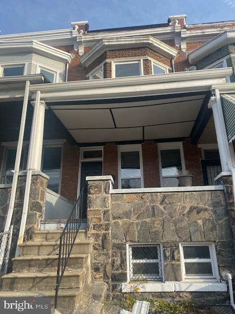 Interior Rowhome with updated flooring and bathroom that is in need of finishing. The property is near completion and ready for a new owner. Large front porch for those summer evenings, unfinished basement. Come and get it! The property is sold As-Is, Cash/ Hard Money.