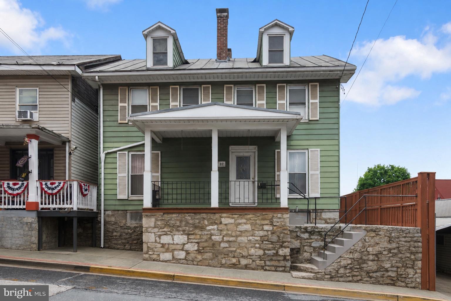 Step into the charm and character of this well maintained mid-1800s home, offering four levels of truly exceptional living space in the heart of Union Bridge. With generous room sizes, abundant storage, and flexible living areas, this home offers endless possibilities for today's lifestyle.  Officially featuring 4 bedrooms and 2 full baths, the home's versatile floor plan includes several additional rooms that could easily serve as a 5th bedroom, home office, hobby room, or playroom, making it an excellent option for multi-generational living and extra storage space. One of the home's most surprising features is the basement, a rarity for a home of this era. You'll find one of the cleanest and most well-maintained basements around, complete with a professionally parged stone foundation by a skilled stone mason, concrete floors, and wiring for a generator, offering both peace of mind and exceptional storage.  
The real showstopper awaits at the top of the home. A full staircase leads to an expansive attic ready to become whatever your heart desires—an art studio, home gym, game room, additional living space, or private retreat.  While this home has benefited from thoughtful updates over the years, there's still room to add your own personal style and finishing touches. If you've been searching for a home filled with character, incredible space, and unlimited potential, this is one you won't want to miss.  Check out the back yard, front porch, large wrap deck, carport, oversized 1 car garage (w/ electric and concrete floor) for off-street parking.  Must see !