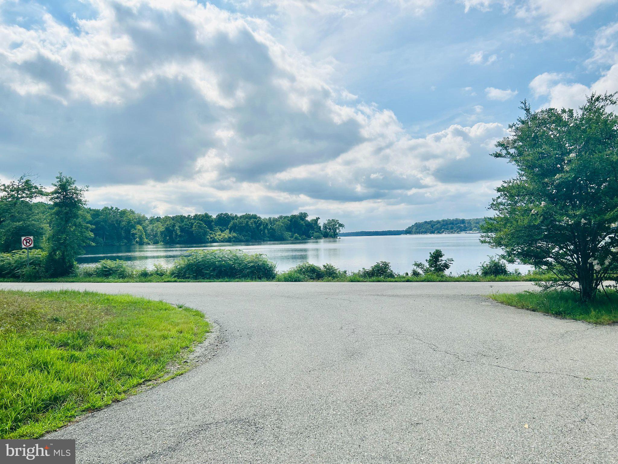 This lot conveys with Lot 22, 14416 Leonard Calvert Dr. for a combined total of 2.14 acres. Sellers will allow time for Contingencies to be satisfied. Nestled on a generous 2.14-acre lot, this exceptional land opportunity offers a serene escape with breathtaking views of the tranquil Piscataway Creek. Imagine crafting your dream home where the gentle sounds of the flowing water create a soothing backdrop to your everyday life. With private access to the creek, you can indulge in leisurely afternoons by the water, enjoying the beauty of nature right at your doorstep. This exclusive community invites you to embrace a lifestyle of quiet luxury and tranquility, surrounded by lush landscapes and the calming presence of water features. The navigable waters provide endless possibilities for outdoor adventures, from kayaking to peaceful strolls along the banks. Seize the chance to create a sanctuary that reflects your personal style while enjoying the unparalleled beauty and comfort this unique setting offers. Experience the perfect blend of simple elegance and nature, where every day feels like a retreat.