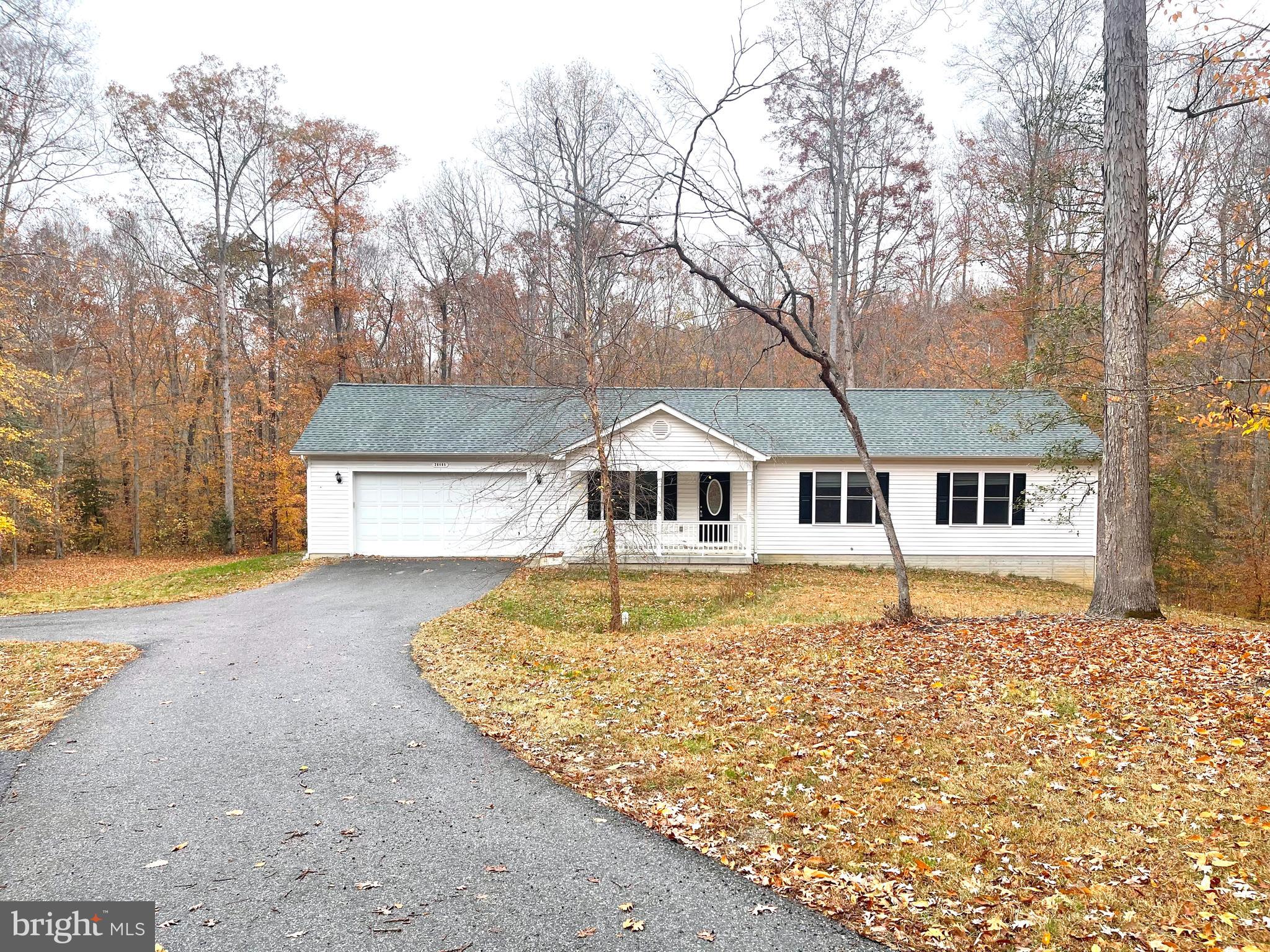 Single level living at its best in this 3BR 2FB rambler with an unfinished walk-out basement and 2 car garage.  The home is located on Hummingbird Way (a private shared driveway) on over 3 acres backing to wooded privacy.  On the main level are the kitchen with center island, living and dining rooms which all share an open floor plan with the rear deck off of the dining area overlooking the large rear yard.  Also on this level are bedroom #1, bedroom #2 with a walk-in closet, hall bath as well as the primary bedroom with walk-in closet and primary bath.  On the unfinished walk-out lower level is the laundry area, storage shelving and plenty of open area to use as best fits your needs.  There is also a large 2 car front load garage with automatic opener and storage shelving.    Pets are a case-by-case basis.