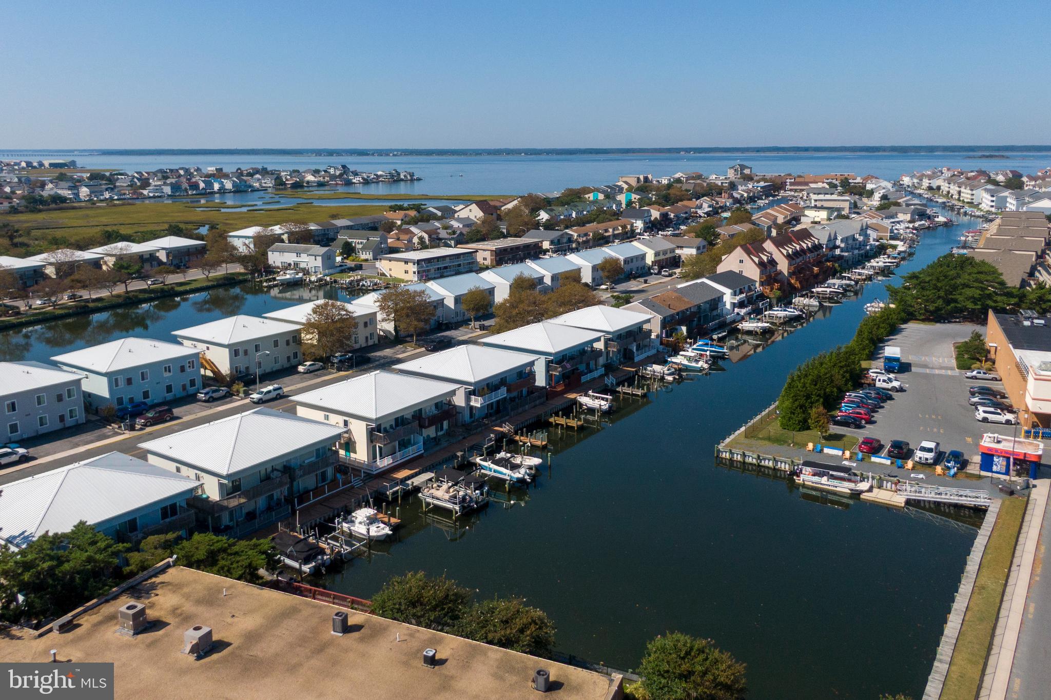Ahh the good life!  The perfect day starts with coffee on the patio overlooking the water. Next it's time to pack the cooler, grab the fishing poles and step onto your boat on the deeded dock.  After some fun on the water, you can spend the afternoon going to all the nearby fun. Within a block and a half, you will find the Atlantic Ocean, grocery store, pizza places, healthy playa bowls and 2 blocks from an Ice cream shop. Right around the corner is the world famous Green Turtle which is always a fun spot to grab dinner. Some features for this fully furnished unit included 3 bedrooms and 2 full bathrooms, ground level unit, primary bedroom that overlooks the canal and a deeded dock. It's time to make family memories at the beach and after all.....You Deserve It!