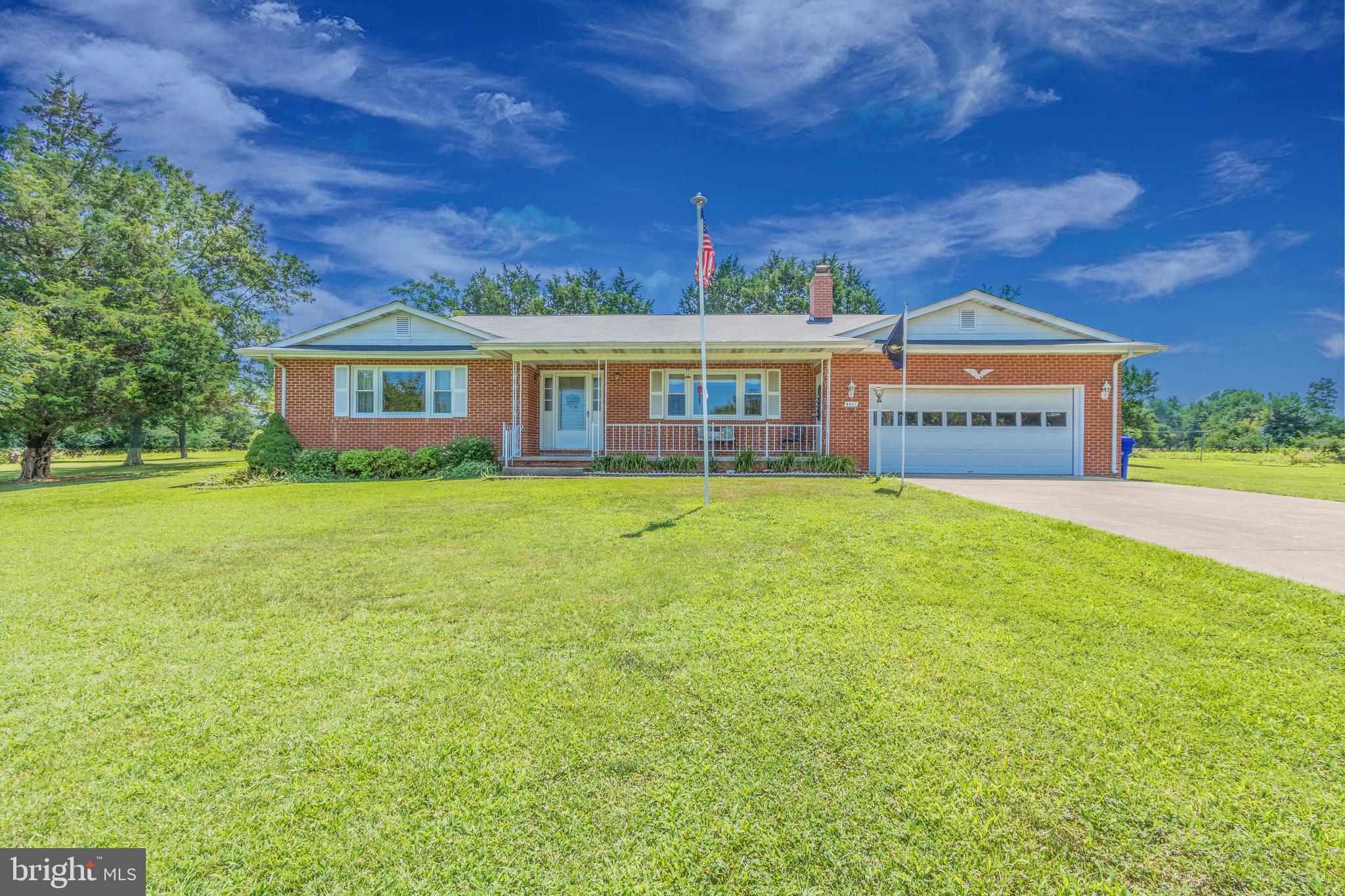 Updated and meticulously maintained all brick home on almost 2 acres! Tons of storage for all of the tools and toys. In addition to the attached 2 car garage there are 3 storage sheds and a large workshop with electric! Concrete pad in front of the workshop is perfect for parking your camper or boat and has electric and water hook-up. Large fenced in area ready for a garden. Gorgeous kitchen with ceramic tile floor, granite countertops, stainless steel appliances and tile backsplash. The eat-In kitchen has a breakfast bar and dining area. Cozy family room with wood stove insert. Three season sunroom off of the kitchen was just remodeled in 2015. Large laundry room with utility sink, cabinets and counter space convenient for folding. Wood floors throughout bedrooms and hallway. Quiet neighborhood of only 3 homes! No HOA and No covenants.  Eligible for 100% financing (if eligible) through USDA. Energy efficient windows (2015), Roof (2013), fuel tank (2015), chimney rebuilt (2013)