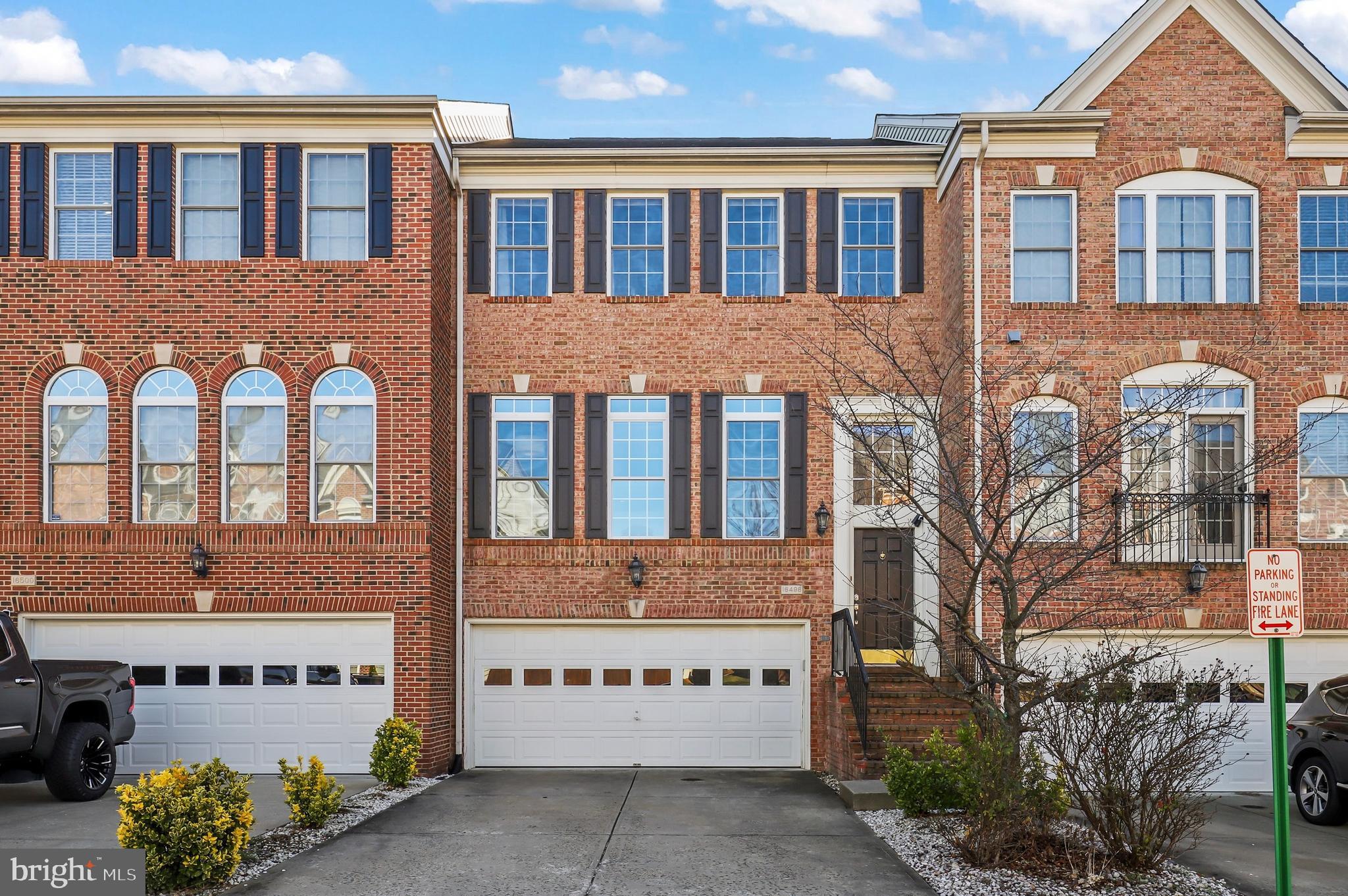 Nestled on a quiet street in sought after Port Potomac, this beautifully maintained townhome welcomes you with a stately brick front, full two-car garage with plenty of storage plus a two-car driveway. The spacious and open concept interior features a 1.5 story foyer, stylish and durable luxury vinyl plank flooring in basement, hardwood floors on main level, bamboo floors on the upper level, beautifully updated light fixtures and ceiling fans throughout, recessed lighting, crown/chair molding, plenty of over-sized windows to really let the natural light in and fresh neutral paint throughout. The gourmet kitchen is a chef’s dream with an abundance of cabinets/counter space, closet pantry, granite countertops, stainless steel appliances with double oven, large island with breakfast bar and opens to an entertaining/dining space ready for game night or a cozy night in next to the fireplace. Three generous bedrooms upstairs include a spacious primary suite with vaulted ceilings, two walk-in closets and a spa-like en suite bath with double vanities and large soaking tub. Upstairs laundry for added convenience. Large walkout basement with a fourth bedroom, full bathroom and rec room with kitchen-like wet bar offering great income/multi-generational suite potential. Spend countless afternoons relaxing or grilling with friends on the private deck overlooking a serene overflow pond and wooded area. Amenity filled neighborhood including indoor and outdoor pools, fitness center, club house, sports courts/fields and more while just minutes to groceries, shopping, dining, entertainment and major commuting routes. Plenty of visitor parking near home. Don’t Miss Out!