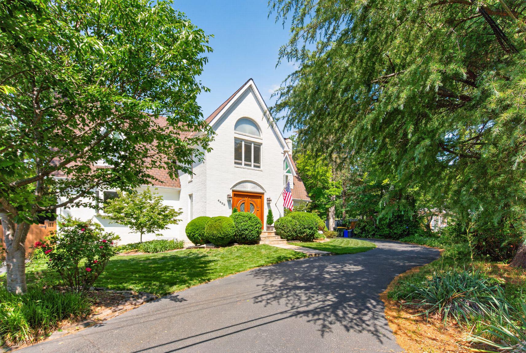 IMPROVED PRICE! A very special custom estate home featuring one of THE MOST GORGEOUS POOLS in the area.  Renovated and expanded, the home includes a stately foyer with travertine flooring and mahogany front doors, one-of-a-kind 3 story great room with Palladian windows, hardwood floors, and 2 balconies, large elegant dining room, and updated eat-in kitchen with granite counters & stainless appliances.  UNIQUE SUPER-PRIVATE bedroom layout with dual upstairs wings.  Primary bedroom has vaulted ceilings, windows on 3 sides, adjoining office loft, and a luxurious bathroom featuring designer tile and extensive cabinetry & woodwork. Additional top floor bedroom/office with ensuite bath & balcony overlooking rear yard. Lower level includes substantial family room and potential 5th bedroom & bath.  The oversized backyard is a private oasis, featuring a gorgeous in-ground pool, substantial decking, and professional landscaping.  Oversized 2 car side-load garage with custom cabinets & finishes.  This substantial home is an architectural gem with loads of character and will not disappoint.