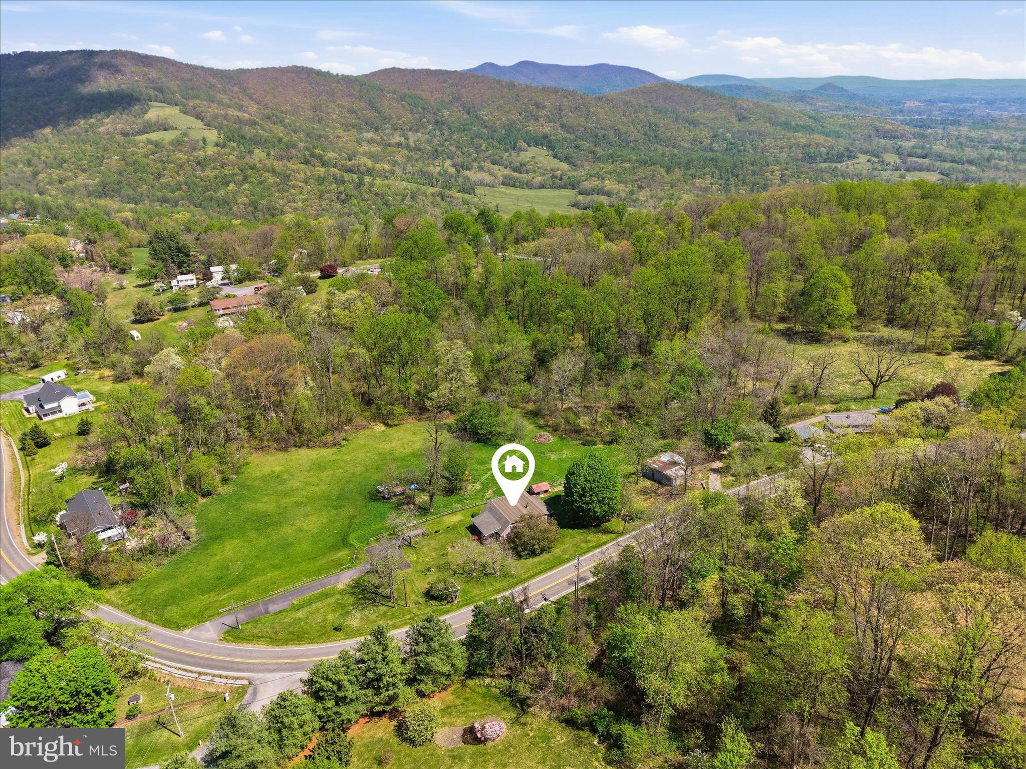 Nestled in a private and picturesque setting in Rappahannock County, what's not to love about this well-maintained, comfortable 4 bedroom, 2 full bath country home that offers approx. 2,304 finished sq ft of living space for an affordable price !  There are few things more relaxing than having a front porch where one can enjoy peace and quiet and beauty of nature.  This home offers a spacious living room, a separate dining room, an eat-in kitchen, and separate family room off the kitchen, (2) main level bedrooms and a full bath.  Upstairs there are (2) additional bedrooms, a second full bath/laundry room, and an unfinished storage room where one can store holiday decorations and other items that one wants to tuck away.  Please note that Comcast/Xfinity internet and cable television are available at this location for those who desire this !  Recent updates include new carpeting - and a new heat pump/central heating and cooling system, water heater, and pressure tank were installed in 2025.  Located off a paved county/state-maintained road, this property offers easy access to nearby popular wineries, a variety of restaurants, shopping centers, local entertainment, and the charming and quaint shops in both Rappahannock and Warren County.  Since downtown Front Royal is only an approx. 5 mile drive from the house, this makes access to stores, gas stations etc. very convenient.  Nature lovers and outdoor enthusiasts will also appreciate the close proximity of this home to the Appalachian hiking trail, the scenic Skyline Drive and Shenandoah National Park, water activities of the Shenandoah River and more !   All things considered,  this home offers country living at its best !