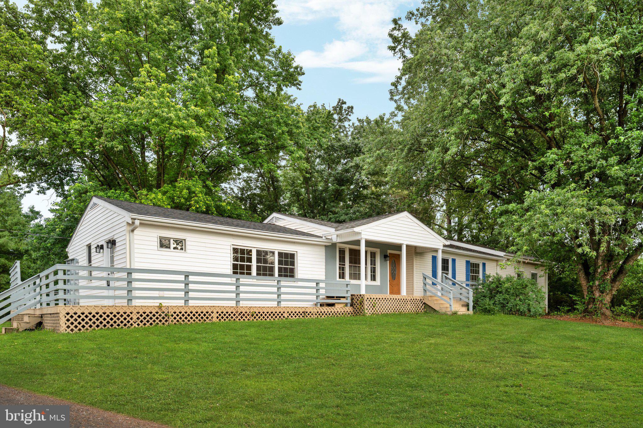 Welcome to 569 Triple J Road—a beautifully renovated 3-bedroom, 3-bath home situated on 2 private acres in the heart of Clarke County. Offering  modern updates and peaceful country living, this move-in-ready property is just minutes from Berryville, Winchester, and Route 7, providing convenient access to shopping, dining, and commuter routes while maintaining the privacy and tranquility of a rural setting.

One of the home's standout features is the nearly 1,000-square-foot addition, offering exceptional flexibility to fit your lifestyle. Whether you envision a spacious family room, home office, den, playroom, fitness area, or a combination of uses, this versatile space provides endless possibilities for how you live and work.

Nearly every major component of the home has been updated for peace of mind. Recent improvements include a new architectural shingle roof (2026), HVAC system with new furnace and A/C (2026), hot water heater (2025), pressure tank (2025), LeafGuard gutter system (2015), luxury vinyl plank flooring and carpet (2026), renovated bathrooms (2026), fresh interior paint (2026), new sliding glass doors (2026), a freshly painted deck (2026), and a new exterior-vented kitchen hood (2026).

Step outside and enjoy beautiful mountain views, fresh country air, and the constant breeze that makes the property especially enjoyable during the warmer months. The expansive two-acre lot offers space to garden, entertain, or simply relax while taking in the peaceful surroundings.

Clarke County is known for its strong sense of community, active county fairgrounds, thriving 4-H and FFA programs, local farmers markets, and weekend events, including the popular flea market near Dinosaur Land. Enjoy nearby favorites such as NIK's Italian Kitchen, Umberto's Pizza, Daily Buzz Café, downtown Berryville, and convenient shopping at Costco in Winchester.

If you've been searching for an updated home with acreage, flexible living space, privacy, and a location that offers the best of both country living and modern convenience, 569 Triple J Road is ready to welcome you home.