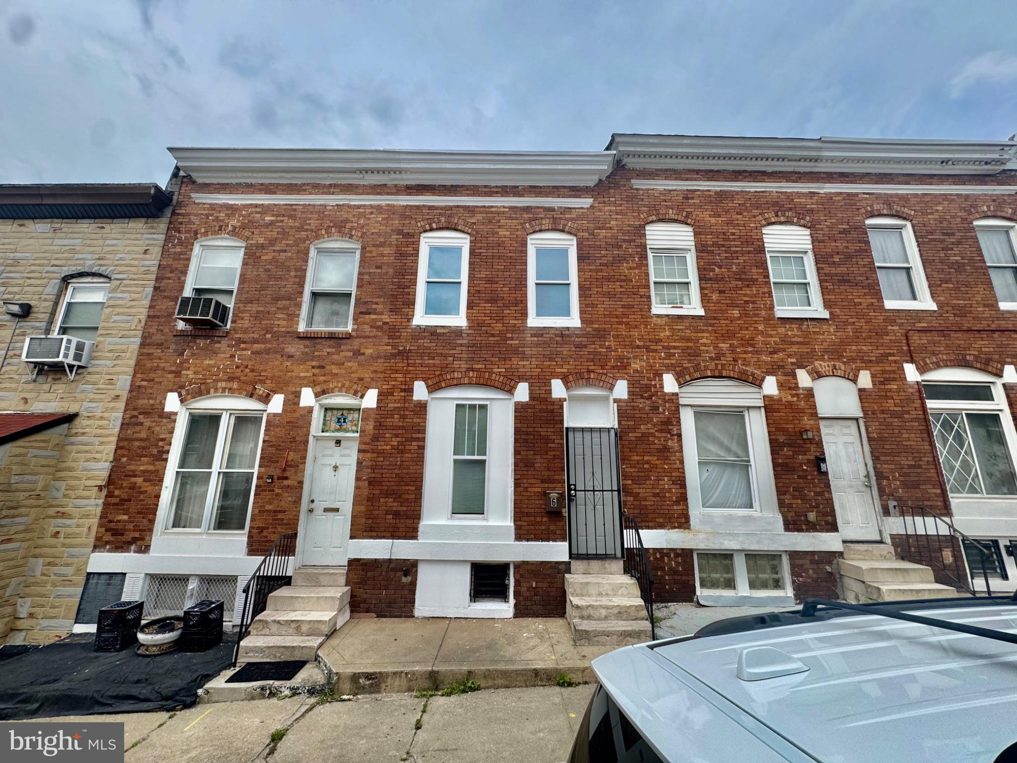 Well-maintained brick rowhome featuring fresh paint on both the exterior front and throughout the interior. The main level offers a convenient full bathroom and bedroom, ideal for guests or added accessibility. The home features luxury vinyl plank (LVP) flooring throughout, along with a new gas range, new refrigerator, and stainless steel microwave. The second floor includes an additional room that is perfect for a home office, study, or flex space. Both bathrooms are equipped with medicine cabinets to maximize storage. All bedrooms include ceiling fans for added comfort. Enjoy the spacious rear patio, perfect for outdoor entertaining or relaxing.
This property may qualify for the Buy Back the Block program and is also an excellent opportunity for investors, as the area qualifies for Section 8 housing assistance.