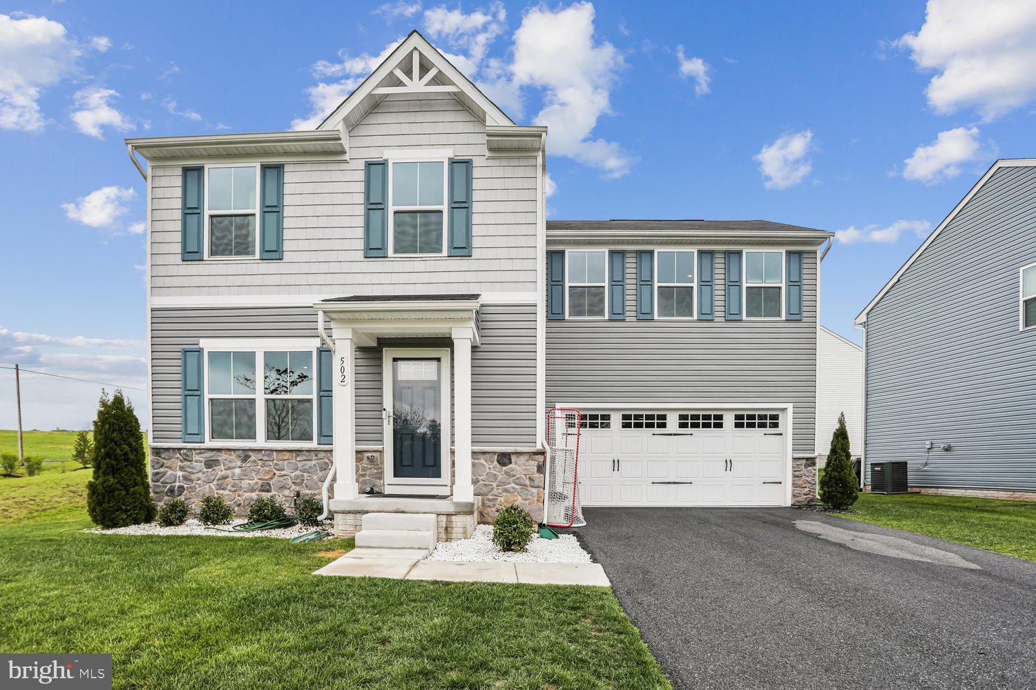 This gorgeous "almost-new" home is move-in ready.  Neutral throughout.  Luxury vinyl plank on main level.  Gourmet kitchen with granite counters and Stainless Steel appliances and large center island.  The upper level has a large primary suite with its own primary bath.  Three other bedrooms on upper level with hall bath.  Laundry room on upper level.   Unfinished basement is awaiting your touches for additional space.  Corner lot with a large backyard and lovely views.