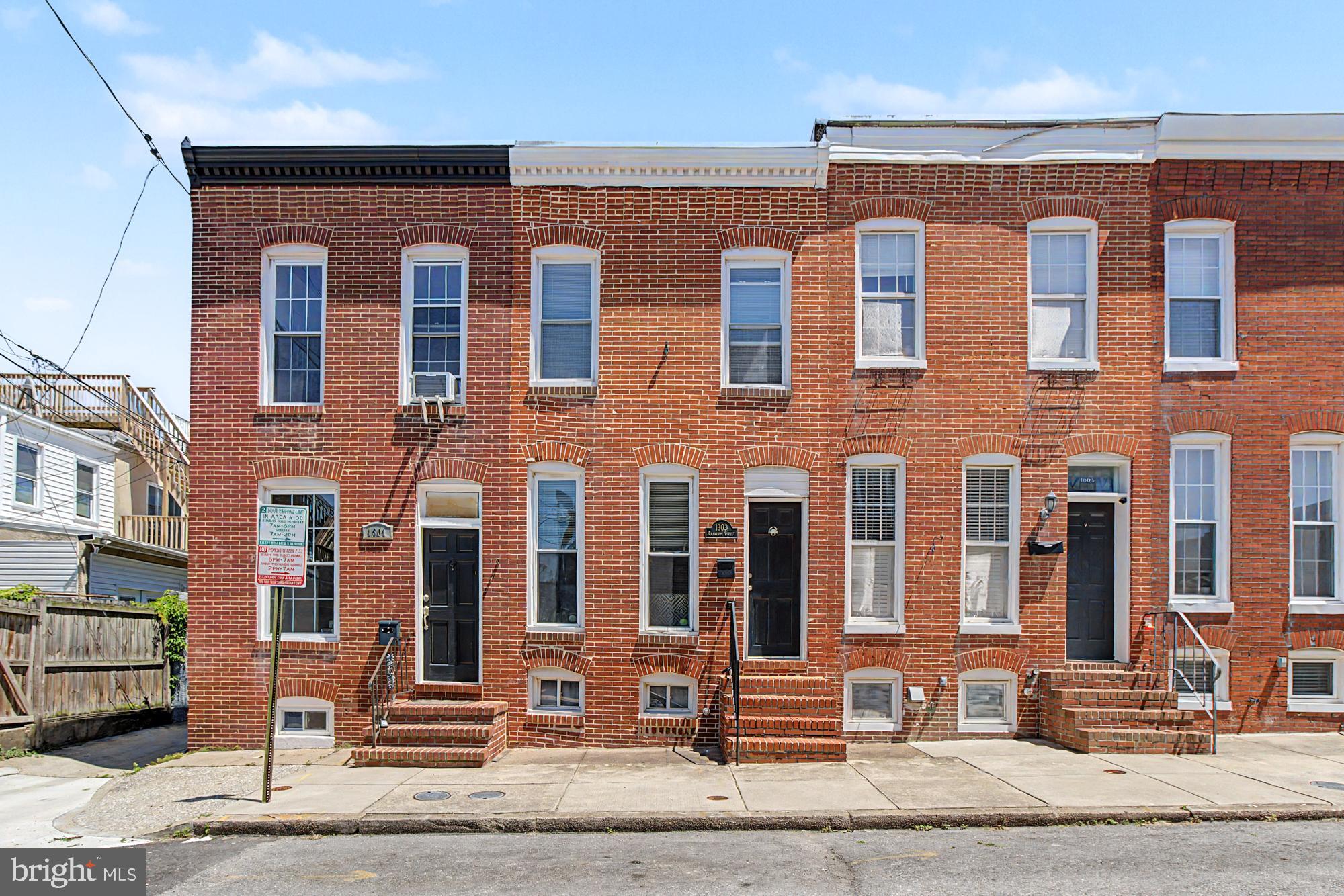Welcome to 1303 Clarkson Street, a charming Federal Hill rowhome tucked away on a quiet one-way street with your own parking pad out back! This 3 bedroom, 1.5 bath home features an open floor plan centered around a classic staircase design, creating the perfect blend of character and functionality. The updated kitchen offers stainless steel appliances, a tile backsplash, granite countertops, and eat-in options at the kitchen peninsula or attached dining area. The main floor has great flow for entertaining and the hardwood floors and natural light add warmth throughout. Off the kitchen you have the entryway to the fenced-in parking pad with a custom-made tailgate table! And a half bath with laundry (washer and dryer new in 2025). Upstairs you'll find the three bedrooms and a full bathroom. Conveniently located near shops, restaurants, stadiums, and commuter routes, this is city living at its best in the heart of Federal Hill.