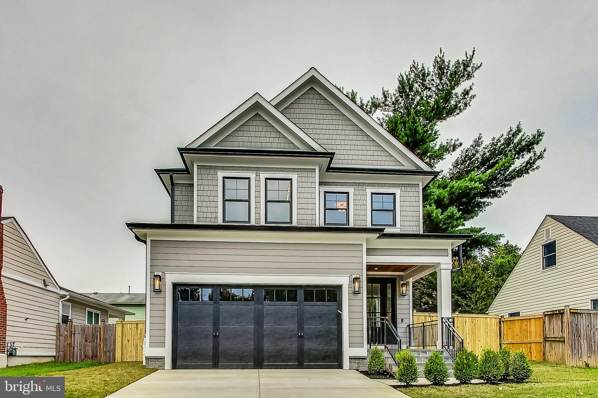 Price Improvement to $1,625,000.  Another ERB Properties masterpiece in Downtown Kensington.  Newly constructed 5 bedroom, 5 and 1/2 bath farmhouse on a quiet street.  Light oak floors run along the main and upper levels.  Enter this home through the covered porch into the foyer .  To the left you will find a powder room, the mud room and the door to the two car front loading garage.  Further into the main level the formal living room awaits which is adjacent to the formal dining area.  Large windows and high ceilings along with the open floor plan provide bright and vibrant living.  The gourmet kitchen has stainless steel Jenn Air appliances, shaker style cabinetry and quartz counters and backsplash along with a quartz waterfall island. The kitchen is open to the the family room with gas fireplace and white oak mantel  and breakfast nook.  French doors lead you to the fully fenced backyard with slate stone patio.

Upstairs has 4 generously sized bedrooms, including the primary bedroom with vaulted ceilings, 2 walk in closets and the primary bath with quartz tile on the floor and walls.  A glass enclosed shower, large soaking tub, and separate water closet compliment the bathroom as well.  Down the hall are 3 additional bedrooms, 2 of which share access to a ‘Jack and Jill’ style bathroom. The fourth bedroom has an en-suite bath. All the bedrooms have ample closet space.  The laundry room is located on this level with front loading Samsung washer and dryer with a sink, countertop and storage cabinets. The top floor features a nook that is perfect for use as a bonus family room area or office space.

The basement level has luxury vinyl floors throughout and tall ceiling height making it perfect for entertaining. The wet bar with custom cabinets and plenty of countertop space make this space unique. There is a 5th bedroom that is adjacent to a full bath perfect for use as a private guest space. There is another “flex” room with two closets ideal for use as an exercise room or Yoga studio.  The basement walks out with steps to the rear and side yards of the house.

Centrally located in the Town of Kensington, walk to the MARC train, shops, restaurants and grocery. Play or exercise in the many parks and trails. Minutes to 495, Silver Spring and Downtown Bethesda.