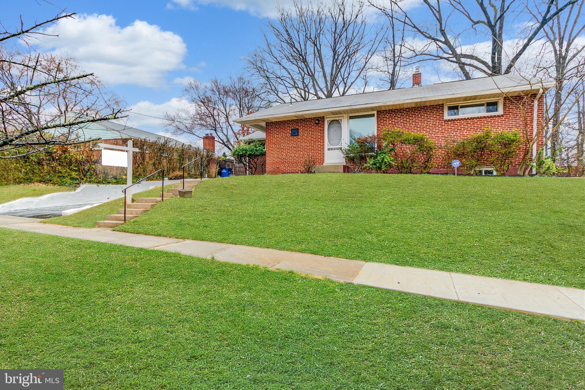 Light, Bright & Airy Mid-Century Modern Gem! All Brick, Expanded East/West Facing Rambler features Hardwood Floors Throughout, Tons of Windows, Sunroom Addition, Deck & Great Back Yard. Main Level with Separate Dining Room opens to Kitchen with Granite and Spacious Living Room, leading to the Sunroom & Deck. Main Level features 3 Generously-Sized Bedrooms & Hall Bath with New Vanity & White Tile. Fully Finished Lower Level features Walk-Up Stairs, Kitchenette, Rec Room/Family Room perfect for entertaining,  Den/Office/Guest Room, Newly Installed Gray Wide-Plank Flooring, and Additional Storage! The Deck leads to Sunny Back Yard (West Facing for Lots of Afternoon Sun!) Recently Replaced Electric Panel, Updated Windows & More. Large Driveway for Off-Street Parking and Fantastic Location with Easy Access to I-495, Four Corners, Rt 29, Grocery, Shopping, Downtown Silver Spring & More!
