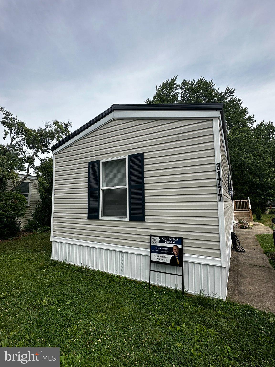 Move-in ready and thoughtfully updated, this 3-bedroom, 1.5-bath singlewide home offers affordable coastal living in the desirable Whispering Pine community, just minutes from the Delaware beaches, Lewes, shopping, dining, healthcare, and everyday conveniences.

Inside, you'll find numerous recent improvements, including new windows, drywall, flooring, carpeting, and more, creating a bright, fresh, and modern feel throughout. The functional floor plan offers comfortable everyday living with well-proportioned bedrooms and inviting living spaces designed for easy maintenance and convenience.

The spacious side deck provides the perfect place to enjoy your morning coffee, entertain family and friends, or simply relax after a day at the beach. All appliances convey, making this home truly move-in ready.

Outdoor enthusiasts will appreciate the home's close proximity to the Lewes Bike Trail, offering miles of scenic biking and walking paths just minutes away.

Located in the well-maintained Whispering Pine community, residents enjoy a low-maintenance lifestyle with access to a community pool, playground, and lawn maintenance, with grass cutting included in the monthly lot rent.

Whether you're searching for a full-time residence, vacation getaway, or affordable beach retreat, this home offers exceptional value in one of Delaware's most desirable coastal locations. Available for immediate occupancy and easy to show—schedule your private tour today and see everything this home has to offer!