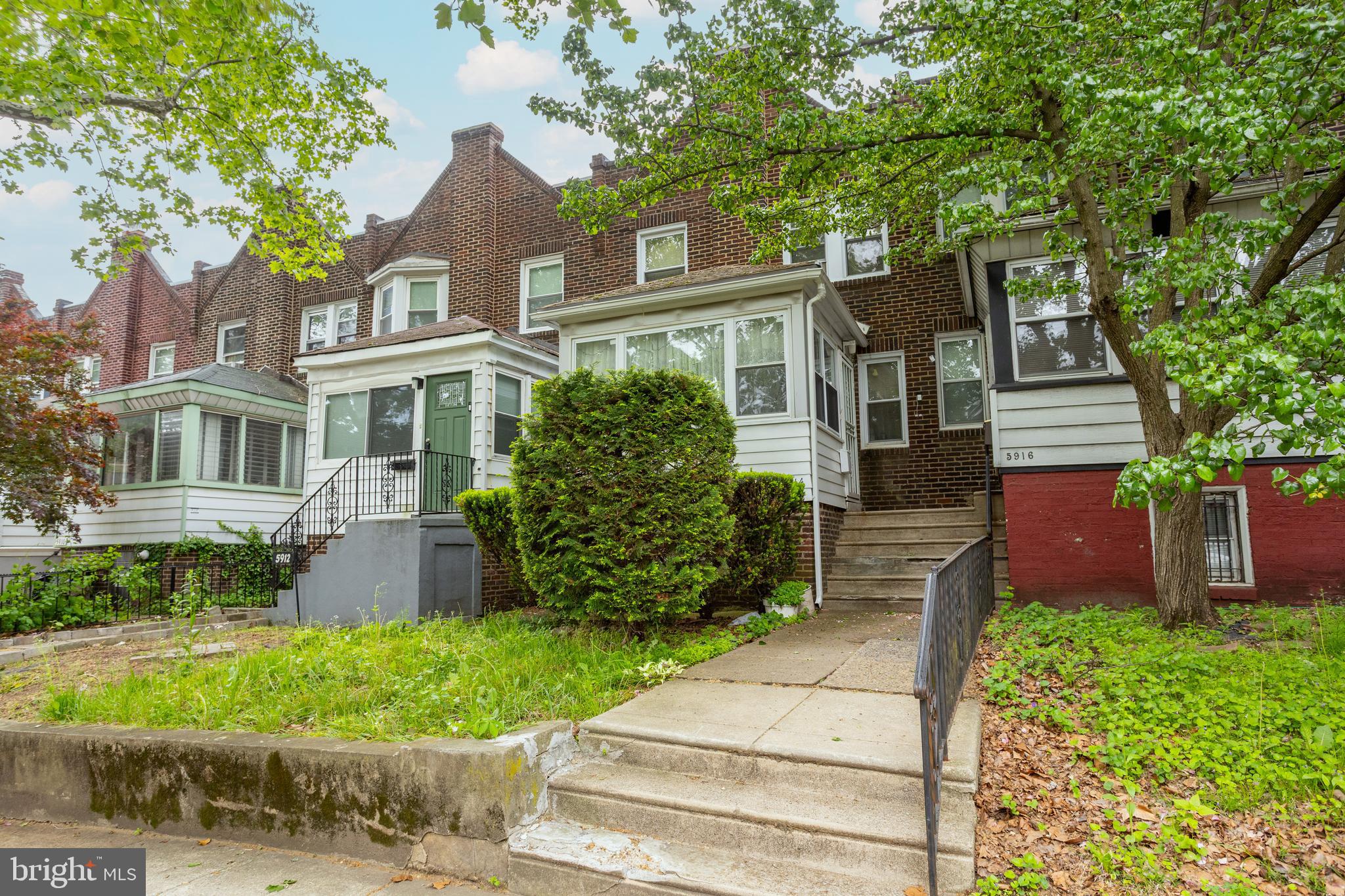 Welcome to 5914 W Oxford Street, a 3-bedroom, 1.5-bath rowhome located on a quiet, tree-lined block in Philadelphia. A short set of steps leads from the sidewalk to the front entrance. Inside, the enclosed front porch features hardwood flooring and provides a bright, welcoming entry. The space flows into the living room, which includes hardwood floors and a brick-surround fireplace, creating a comfortable setting for everyday living. The dining room continues the hardwood flooring and offers a dedicated space for meals and entertaining. The kitchen, located at the rear of the main level, features tile flooring and provides access to the rest of the home. Upstairs, the primary bedroom includes carpet flooring, while the full bathroom offers tile flooring, a tub and shower combination, and a single sink vanity. Two additional bedrooms, one with carpet and one with hardwood flooring, provide flexible space for family, guests, or a home office. The finished lower level expands the living space with a family room area, a laundry room, a powder room, and access to both the garage and backyard. Conveniently located near Lancaster Avenue, local shopping, grocery stores, restaurants, local public transit, and more, this home offers both comfort and accessibility. Don’t miss the opportunity to make 5914 W Oxford Street your new home.