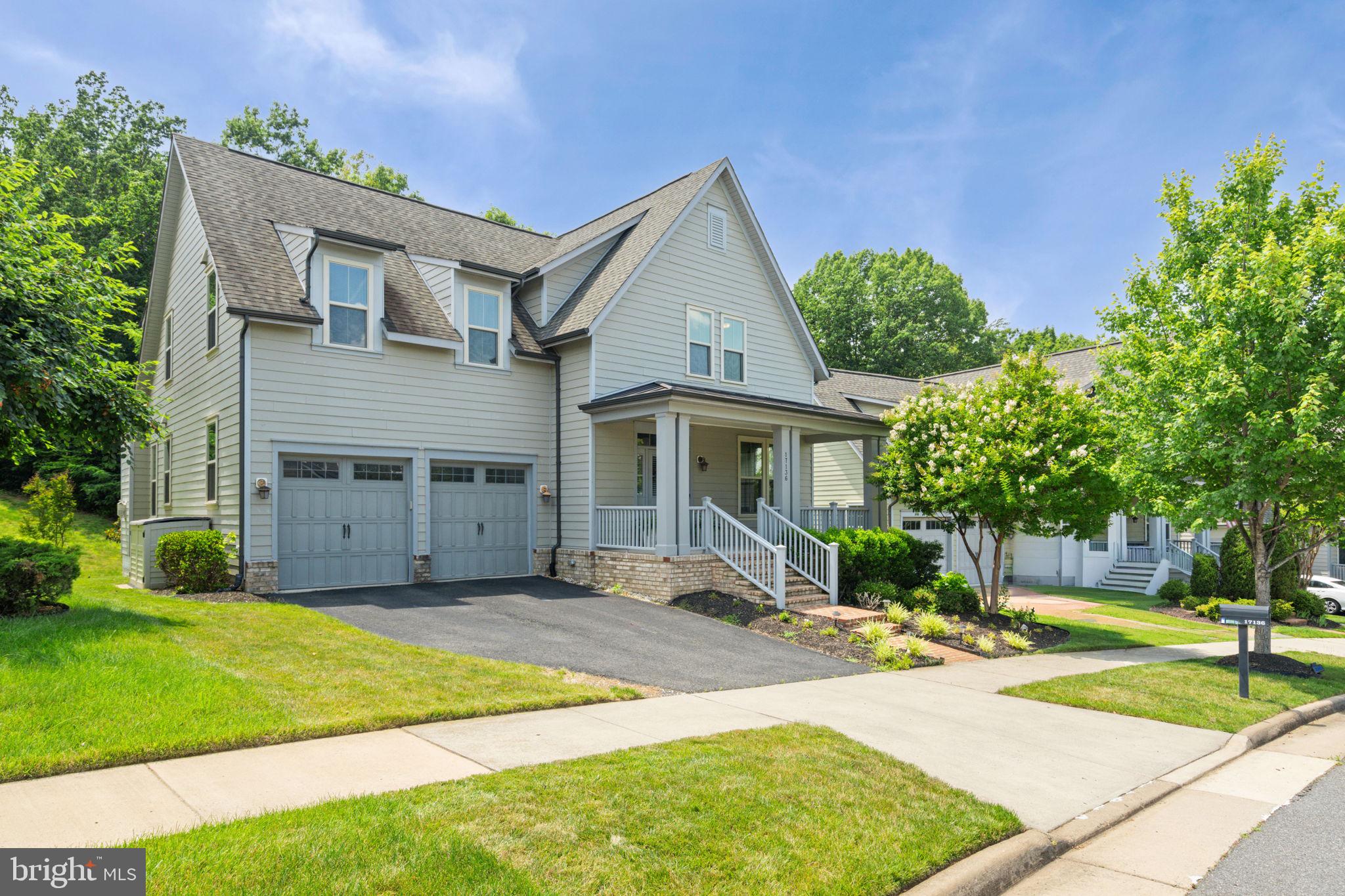 Beautiful Front Porch Home with 5 Bedrooms, 4.5 Baths, Cul-de-Sac street, backing to trees. Move-In Ready in Dumfries, VA 22026. More Home Than You Expected. Better Location Than You Knew Existed.
You searched for space, privacy, and a neighborhood worth settling into. You may not have been looking at Dumfries, Virginia. That is about to change. Located in one of Northern Virginia's most sought-after master-planned communities, this home features fresh paint and carpet, Nine-foot ceilings, and five-inch real hardwood floors that run through the main level, upper hallway, and primary suite. A private home office just off the foyer makes a great work-from-home space. The gourmet kitchen features ceiling-height white cabinetry with glass inserts, granite countertops, double wall ovens, a four-burner cooktop, and a large center island that opens directly to the great room with a gas fireplace, open-concept living. The upper Level: Four Bedrooms, Room for Everyone. The primary suite includes a large walk-in custom closet and a stunning updated bath with dual showerheads and a soaking tub. Three additional bedrooms, two with walk-in closets, and two full baths complete the upper level. Everyone has space. No one is sharing a bathroom who does not want to. The Basement is designed for serious entertaining. Approximately 1,000 square feet of custom pub space with a live-edge black walnut wet bar, built-in dishwasher, kegerator, dual-zone wine and beverage refrigerator, and luxury vinyl plank flooring throughout. The pool table conveys. A fifth bedroom, full bath, and direct backyard access make this level fully usable for guests, in-laws, or older kids who need their own space. There is nothing else like it at this price point in this zip code—Outdoor Living With a Wooded, Private Backdrop. A deck plus a 500-square-foot paver patio with a seating wall gives you real outdoor living space. Mature trees create a fully private backdrop. The golf course sits just beyond the tree line, giving you green views and quiet without the exposure or the maintenance of a course-facing lot.
The Community: Northern Virginia's Best-Kept Secret Is Not a Secret Anymore. This home sits inside a 2,000-acre master-planned community along the Potomac River that most Northern Virginia buyers do not find until a friend tells them about it. Once they see it, they usually do not look anywhere else. Resort-style pools, a fitness center, a 13,000-square-foot community center, a restaurant, and a golf club with a resident discount,   10 miles of scenic trails with a planned future connection to the 900-mile Potomac Heritage National Scenic Trail. Neighborhood schools, shopping, dining, and a future VRE Rail stop are all coming. This community is still building. Buyers who get in now are getting in before the full transformation is finished. Location: Closer to Everything Than the Address Sounds. Direct access to I-95, Marine Corps Base Quantico, Fort Belvoir, and Washington DC. The Rippon Landing and Quantico VRE stations are accessible now. If you are relocating from out of state, executing a PCS move, or commuting into DC and want significantly more home for your money than closer-in Northern Virginia offers, the location and math work strongly in your favor. Schedule your showing today!