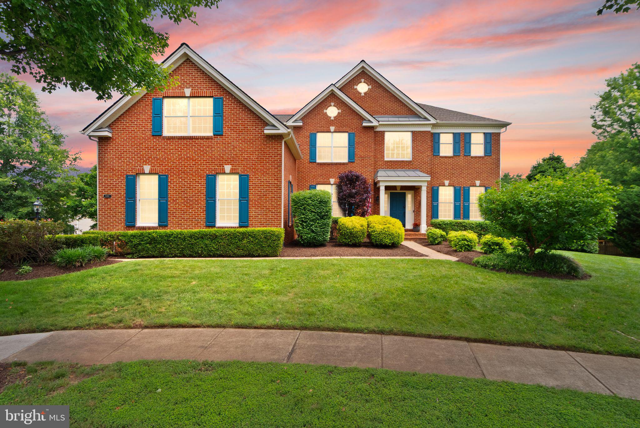 Welcome to 5397 Cedarville Court, a stunning, meticulously maintained 6-bedroom, 4.5-bath residence with a 3-car garage, ideally situated on a rare half-acre cul-de-sac lot within the prestigious, gated, tree-lined community of Dominion Valley Country Club. Offering over 6,000 square feet of beautifully finished living space, this exceptional home has been thoughtfully updated from top to bottom with no expense spared, as it was intended to be a "forever home." 

A dramatic two-story foyer and gleaming hardwood floors set the tone for the elegance found throughout. Soaring ceilings, expansive windows, and abundant natural light create an inviting atmosphere that feels both grand and comfortable. The formal living and dining rooms flank the entry and provide versatile spaces for entertaining, gathering, or working from home.

At the heart of the home is the spectacular gourmet kitchen, featuring white cabinetry, stainless steel appliances, endless quartz countertops, and remarkable attention to detail. Custom storage solutions include spice cabinets, pull out drawers, an appliance garage with dedicated outlet, magnetic child-safe lower cabinets, and two separate pantries. The spacious breakfast area, surrounded by windows, seamlessly connects to the expansive deck, creating the perfect setting for everyday living and effortless entertaining.

The adjoining family room showcases a stately stone fireplace, custom built-in shelving and cabinetry, and a large multi-purpose storage closet that can serve as a secondary pantry. A spacious home office, laundry room, and powder room complete the main level.

Go upstairs via either the front or the back staircase, where you will find the luxurious primary retreat which offers a peaceful escape with a sitting area, vaulted ceiling, beautiful natural light, and extraordinary custom-designed closets. The spa-inspired primary bath features a Jacuzzi tub, walk-in shower, dual-sink vanity, and generous linen storage. Four additional spacious bedrooms, each with custom closet systems, are complemented by two updated full baths. The 5th bedroom could be used as an enormous bonus room ideal for a media room, playroom, craft room, additional office, or secondary family room.

The recently finished lower level expands the home's versatility even further. Complete with a sixth bedroom, fourth full bath, and expansive recreation space, this level is perfectly suited for multigenerational living, movie nights, gaming, fitness, hobbies, or guest accommodations. Ample storage ensures there is a place for everything.

Outside, enjoy the privacy of a beautifully landscaped half-acre lot enhanced by a 10-zone in-ground irrigation system and peaceful cul-de-sac location.

Residents of Dominion Valley Country Club enjoy an unparalleled lifestyle with seven indoor and outdoor pools, sports courts, playgrounds, parks, walking trails, a community center with year-round activities, and a stocked lake with docks for catch-and-release fishing. Optional membership to Dominion Valley Country Club provides access to the renowned Arnold Palmer Signature Golf Course, clubhouse, dining, and fitness facilities. The home is conveniently walkable to a community pool, playground, public library, and Battlefield High School.

With eight guarded entrances providing exceptional security and peace of mind, and endless shopping, dining, entertainment, and commuter options just beyond the gates, this remarkable property truly offers the best of both worlds.