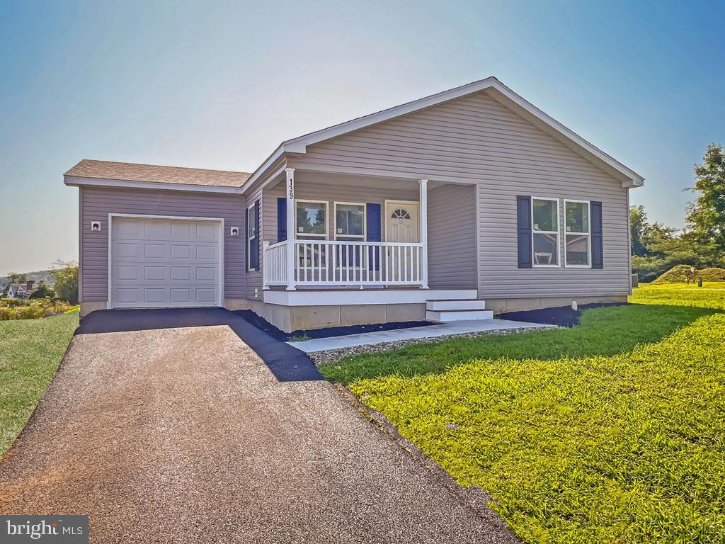 Brand new model home in new 55+ community.  This three bedroom, two bath home includes many upgrades including added cabinets in kitchen, farmhouse sink, recessed lighting,  sliding glass door off dining room leading to private patio and much more.  The main suite is spacious and offers an extra large walk-in closet, double vanity, high rise toilet and shower seating with peerless delta faucets.  The utility room will accommodate a full size washer/dryer and leads to the one car garage for additional storage.  This well appointed home sits on a large corner lot and is ready for viewing. Make it your today.