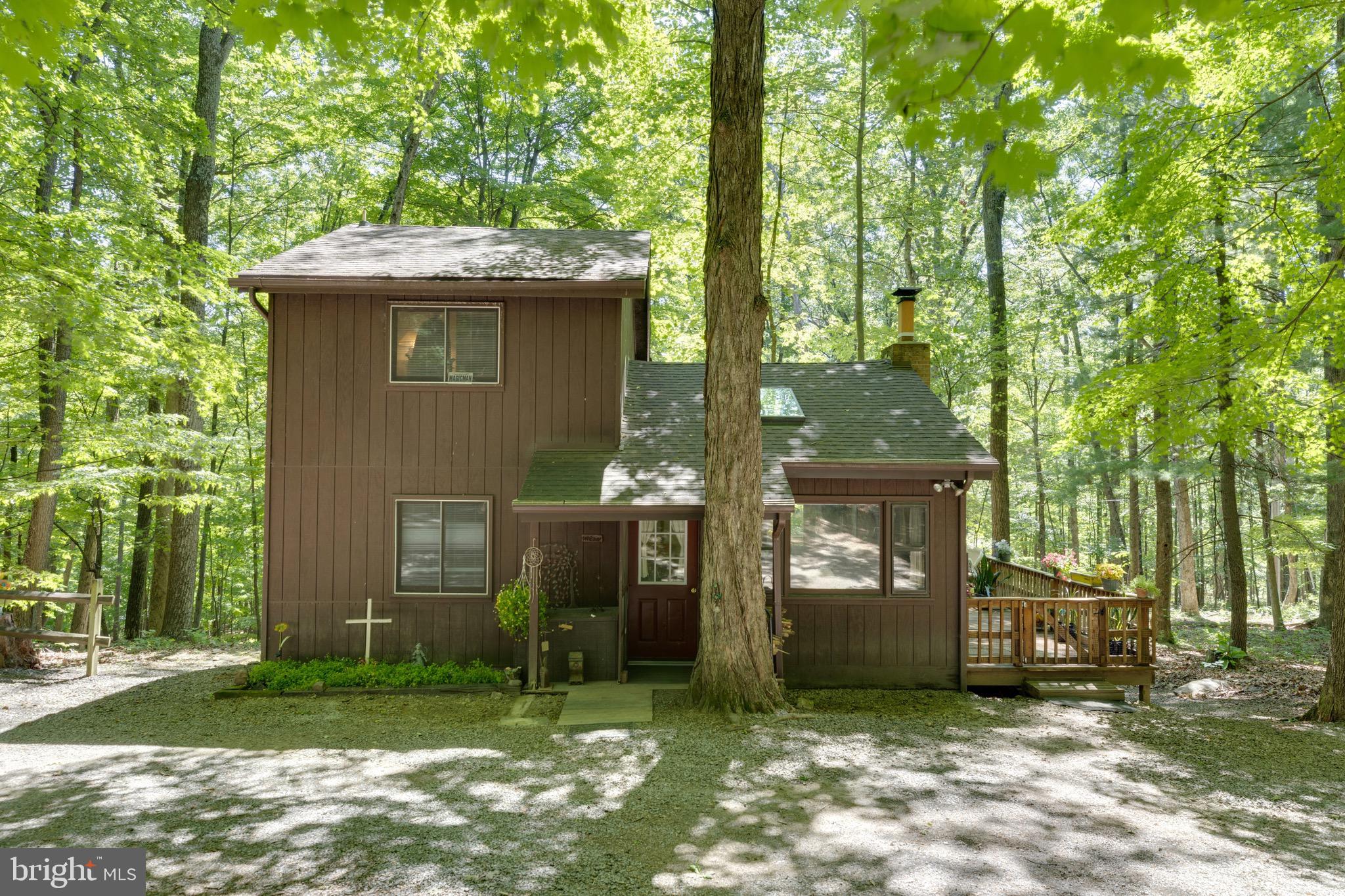 Whether you’re looking for a full-time residence, a peaceful weekend cabin, or an Airbnb opportunity, this updated chalet offers the ideal combination of comfort, recreation, and small-town mountain charm.  
Tucked away in the peaceful mountains of Berkeley Springs, WV this charming chalet-style retreat offers the perfect blend of comfort, privacy, and classic mountain living. Located on a scenic half-acre lot in the desirable Coolfont Mountainside community, this 3-bedroom, 2-bath home is surrounded by nature, quiet surroundings, and beautiful mountain views. 
Inside, the warm wood-burning fireplace creates the perfect cozy atmosphere after a day of exploring or relaxing in the mountains, while the large, enclosed porch and wraparound decking invite you to slow down and enjoy the fresh West Virginia air year-round.
Beyond the home itself, the lifestyle here is what truly makes this property special. Coolfont Resort enhances the experience with access to a restaurant, bar, spa, fitness center, and nearby lake — creating a true mountain getaway feel. 
Just minutes away, downtown Berkeley Springs offers charming cafés, local shops, art galleries, live music, breweries, and the historic warm mineral spas the town is famous for. Outdoor enthusiasts will also appreciate being close to Cacapon Resort State Park, known for its hiking trails, golf course, lake activities, horseback riding, and year-round outdoor recreation.
This home captures the relaxed pace and timeless charm that make Berkeley Springs such a special place to escape, invest, and call home.