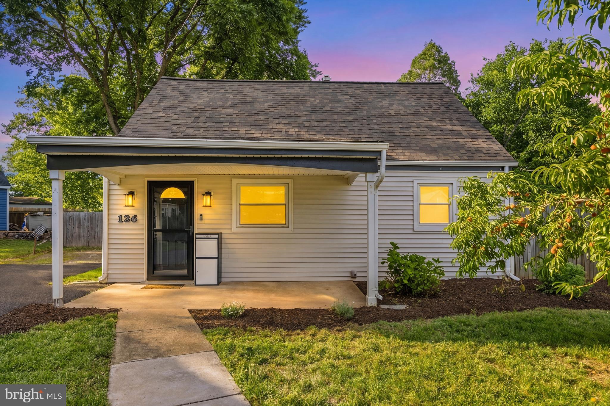 Enjoy main-level living in this charming Cape Cod-style home in Manassas Park. Situated on a quiet street, this property offers a spacious front and rear yard, driveway parking, and ample street parking. Inside, you'll find sleek LVP flooring throughout the main living areas, a large kitchen featuring a gas range, updated countertops, and a pantry for added storage. The living room is filled with character thanks to a cozy wood stove, while the bedrooms offer comfortable carpeting. A delightful sunroom provides additional living space and views of the backyard. The fully fenced rear yard includes a shed, garden area, and plenty of room for outdoor enjoyment. Recent improvements include fresh paint, landscaping enhancements, ceiling fans, electrical outlets, kitchen countertops, and pantry addition. No HOA. Conveniently located near schools, parks, shopping, dining, and major commuter routes, this home offers easy access to everyday amenities while maintaining a peaceful neighborhood setting.