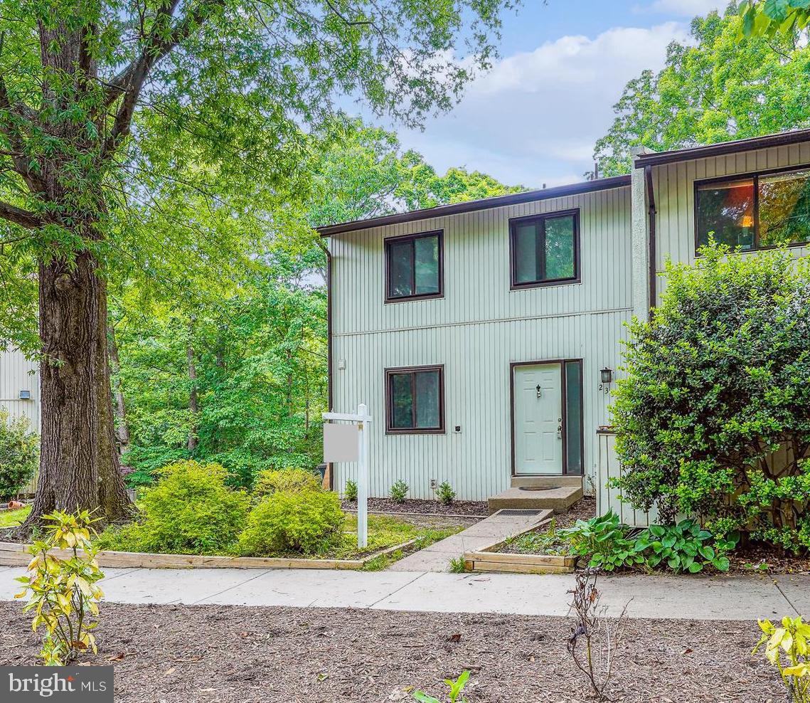 Fresh and clean, private,  3 level end unit backing to open space and trees....Hardwood floors in the entry, living and dining rooms just refinished....Kitchen in the front of the home and has stainless steel appliances and a ceiling fan....Living room across the rear of the home walks out to the private deck....Upstairs are 3 bedrooms and 2 full baths....Main bedroom has a walk in closet....all bedrooms have hardwood floors and ceiling fans....The finished basement is walkout and has a half bath....Rear deck also wraps around the side of the home.....lower level has a patio and fenced rear yard....Interior just painted....Deck and rear fence just restained....Carpet on the both the upper and lower level stairs brand new....Several new light fixtures, register vents, switch plates and more....two reserved parking spaces (328) and lots of open parking along Green Range....Dogwood pool just blocks away.....A little over a mile to the Reston Metro and the Reston Town Center....Heat pump from 2020.  Also supplemental baseboard heat....Roof new in 2023....Floor plan in the virtual tour.