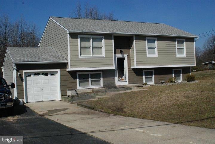 Everything has been done - move right in!  Meticulous owners have made many upgrades including kitchen, baths, fixtures & doors - new paint & carpet. Upgraded kitchen designed for entertaining. Comfortable 4 bed/3 full baths, lots of space for everyone. Private deck overlooking almost 1/2 acre. Garage & plenty off street parking for boat & RV! No HOA. 3Sheds Tons of storage. Close to Ft Meade BWI