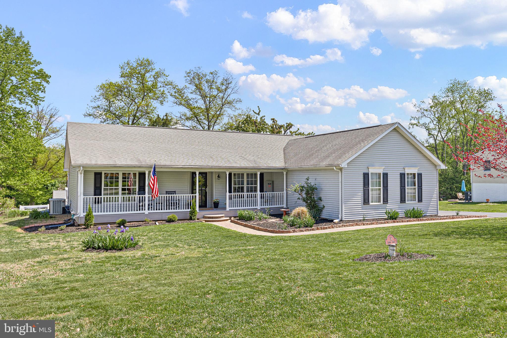 Don't miss this impeccable Open-Concept 3 bedroom, 2 bath, move-in-ready rancher in sought after water-oriented community of Chesapeake Isle!  A brick paved walkway ushers you to a spacious front porch.  Inside, you will find an Open-Concept living area with hardwood flooring and large windows to let the light stream in.  A charming gas fireplace is neatly tucked into a corner providing ample space for your favorite furnishings.  The new kitchen is gleaming!  Bright, crisp cabinets and stainless appliances, a deep farm-style sink and glass tile backsplash make this space pop!  Recessed lighting bounces off of the Quartz countertop onto a breakfast bar which is perfect for mornings and entertaining!  Plank flooring is sleek and makes clean up a breeze.  The Primary Suite is just the place to relax after a long day.  A tray ceiling, large walk-in closet, and sliding doors to the expansive outside deck area create the perfect retreat.  The en-suite bath boasts tile flooring, double vanity sink, and a tile surround soaking tub.  Enjoy brisk mornings or quiet evenings on the spacious, maintenance free outside deck space.  This outside oasis can be accessed from both the main living space and the primary suite.  The den is perfect for an at home office, complete with extra large windows and built-in cabinetry.  Bedrooms 2 and 3 have extra large windows and large closets.  Center Hall Bath has tile flooring and a large walk-in shower . . . perfect for guests.  A laundry/mudroom with washer/dryer, shelving, and storage cabinets is right off of the 2 car garage.  A whole house Generac generator offers safety and power during stormy weather.  An unfinished basement provides plenty of storage.  Nestled between Elk Neck State Park, this water-oriented community of Chesapeake Isle has private boat ramp, harbor area, pavilion, pickleball and volleyball court.  Enjoy scenic hikes through the Park or walk to Turkey Point Lighthouse to enjoy breathtaking views of the Upper Chesapeake Bay.  Close to the town of North East with quaint shops, restaurants, and marinas.  Easy access to I-95.  Welcome home to your Chesapeake Bay Dream!