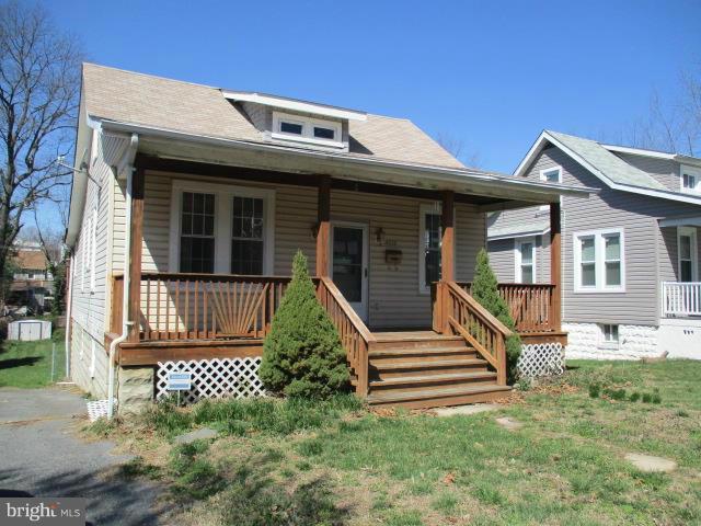 Huge Cape Cod offers full covered front porch and tier deck in rear. Privacy fenced rear yard with shed and off street parking. Home offers 5 bedrooms and 2.5 baths. Open floor plan on main level with full bath and bedrooms.Upper level has 1/2 bath and bedrooms.  Lots of upgrades in the past to include windows, flooring, kitchen and more !! Basement was improved and has full bath with bonus rooms.