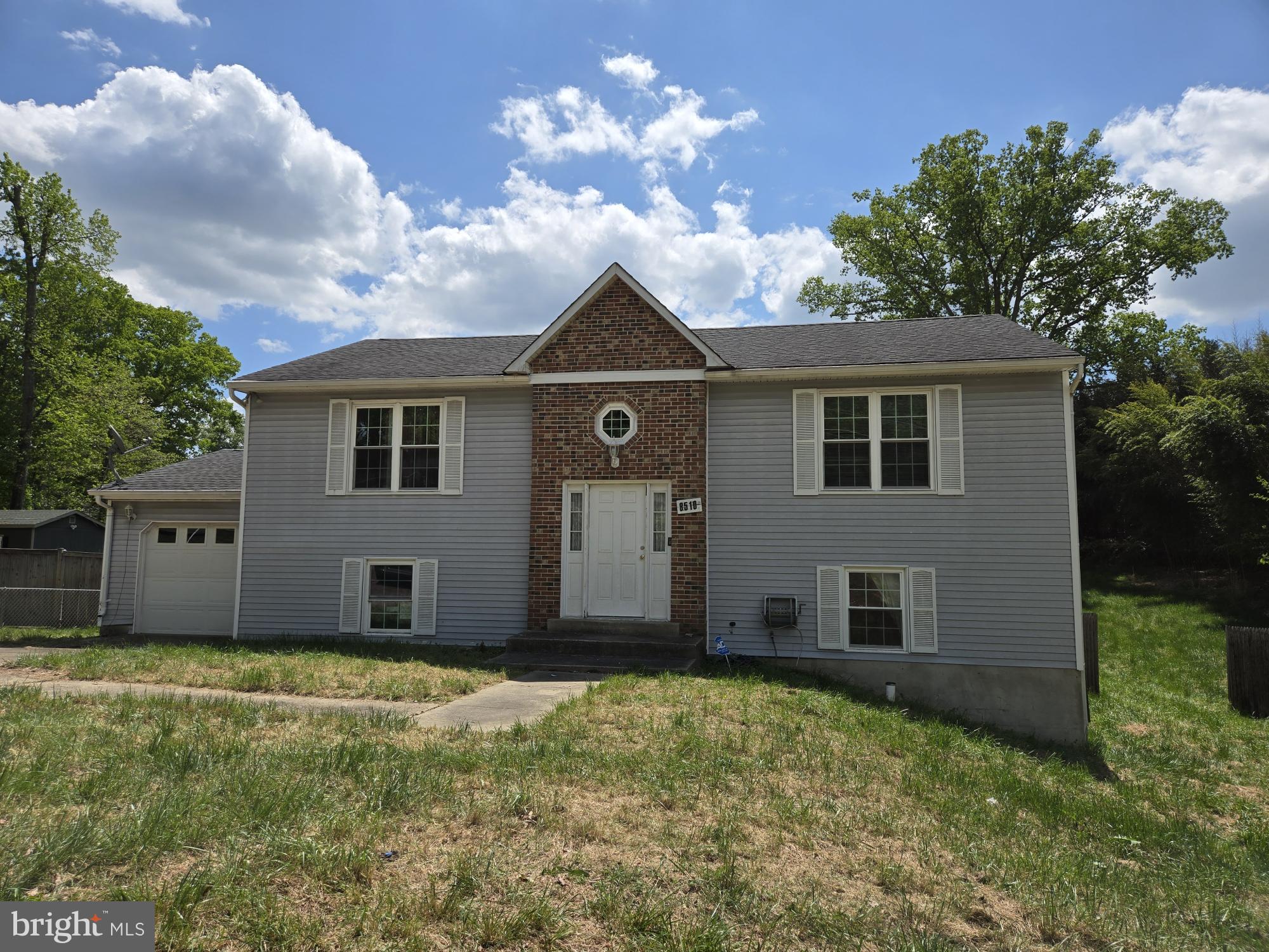 Nestled in the Twinkling Acres community, this charming split foyer home is ready for your personal touches. With 3 spacious bedrooms and 2.5 bathrooms, it's designed for easy living. The main bedroom has an en suite bathroom and the full hallway bathroom has been fully renovated.  The lower level has a large recreation area as well as a bar for entertaining family and friends.  The lower level also has a 3rd bedroom and an extra room that could be your next home office, a playroom for the kids, or a movie room.  Enjoy the generous 20,800 square foot lot, providing ample outdoor space for relaxation or play. The attached garage and driveway offer convenient parking.  Located near all the necessary conveniences and amenities, this neighborhood fosters a strong sense of community.  Experience the warmth of Twinkling Acres, where comfort meets community, and make this house your home!