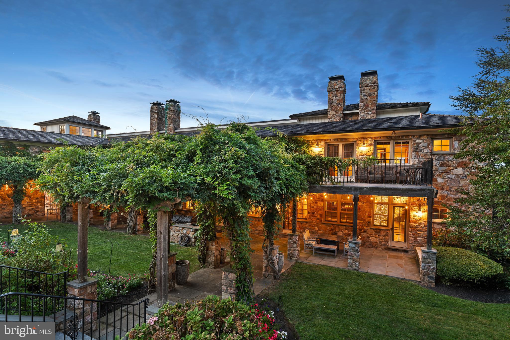 NEW PRICE for this Spectacular European Inspired Manor Home set on 36.6 bucolic acres with endless views of the surrounding countryside. Incredible sunsets and sunrises from all rooms in this Manor Home. This incredible 5 Bedroom, 7.1 bath home has impressive stonework throughout the property both inside and out. A spacious and open floor plan has a soaring vaulted 2 story great room showcasing exposed beams, stone fireplace and French doors to a balcony for easy entertaining. The gourmet kitchen has high end appliances, granite countertops, coffee bar, breakfast area and French doors leading to a terrace, pool with pool house and beautiful gardens with a waterfall. There is a formal dining room with cathedral ceiling, built-ins, stone fireplace and French doors accessing a lovely, covered terrace with an amazing formal rose garden with trellis surrounded by stone walls. Perfect for entertaining and that special occasion! The first floor is complete with a living room and library/den both with fireplaces, enclosed porch, mud room and powder room. The second floor has a luxurious primary suite with fireplace, balcony, coffee bar and two primary baths, one with access to a deck overlooking the gardens, waterfall and pool, perfect for morning coffee. There are 3 additional en-suite bedrooms, laundry room, office and exercise room on the second floor with its own entrance and access to a private terrace. The lower level has an en-suite bedroom, a large rec room and a family room with full bath, sauna and wine cellar, also could be a second en-suite bedroom. All have access to beautiful gardens and manicured lawns. This high-end home has 600-amp service, radiant heat floor throughout, On-demand hot water heaters and a 100 KW Mercedes Diesel Whole House Generator. The barn was converted and is currently being used as office space with radiant heat floor, kitchen and a two-bedroom tenant house with a full kitchen and living room. Perfect for a small business in a private and peaceful setting. For the equine enthusiast the 10-stall center aisle barn could be converted back. There are 5 paddocks with turnout sheds, automatic waterers and a full-size outdoor ring with lights. Completing the barn area is a new 6-car garage with electric and generator as well as an equipment shed for additional storage, perfect for the car enthusiast.  Bordered by the Green Valley Watershed association and acres of conserved land. The Green Valley Watershed is a 197-acre nature sanctuary and arboretum. This property has two tax parcels separated by the Beaver Run Creek and has a French & Pickering Creek Conservation Easement. The partial easement is on 15 of the 36.6 acres, which include the front 13-acre parcel and the back 2.2 acres that borders Welkinweir. The 2.2 acres is in East Nantmeal Township.  The remainder of the acreage with the house is in South Coventry. The farm is a perfect location for the commuter with easy access to the PA turnpike, Exton, West Chester, Main Line, shopping and much more!