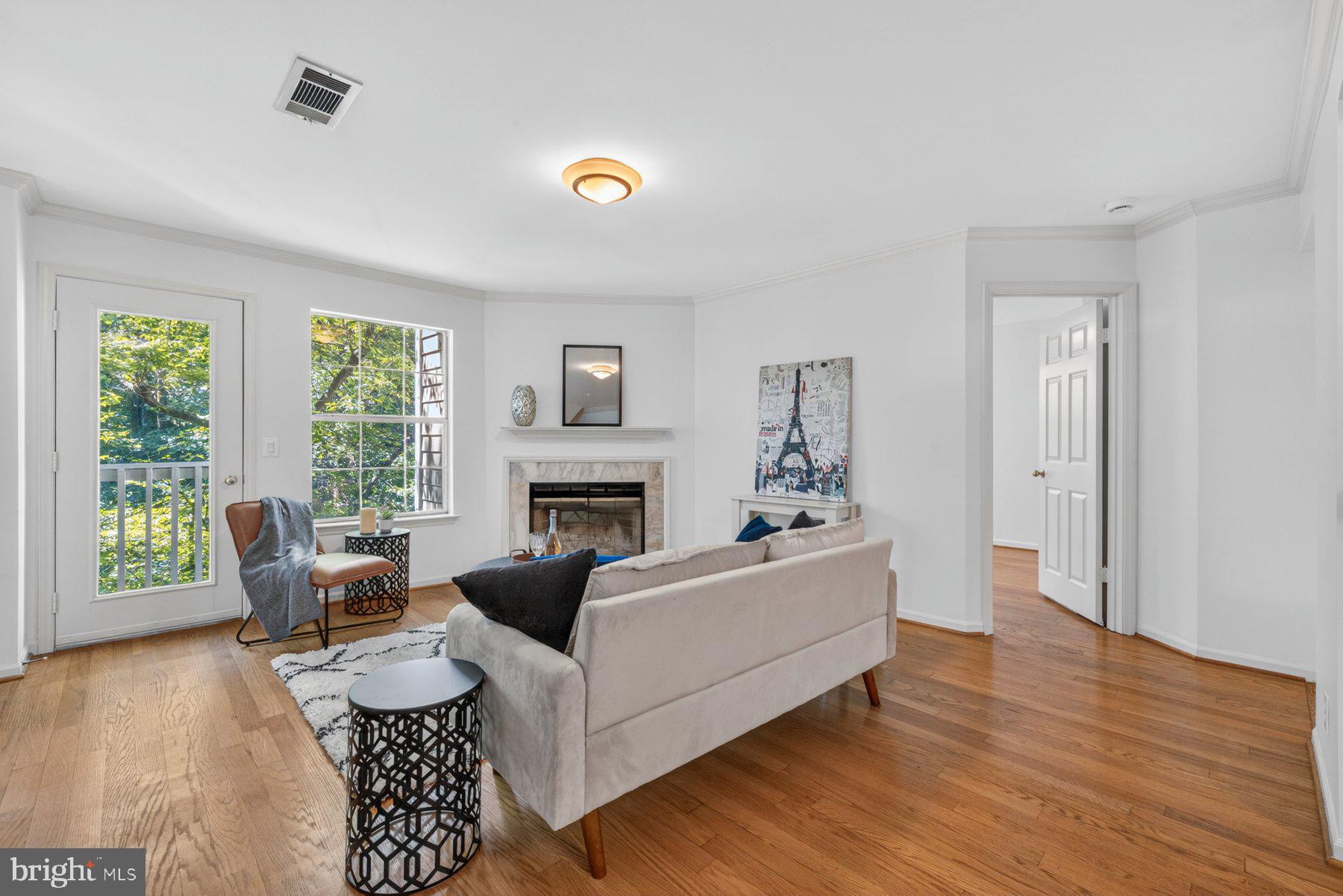 North Bethesda.  This 3 bedroom, 3 bath condo offers a rare blend of warmth, charm, and everyday convenience that makes coming home feel like a deep calming breath!
Step inside and be greeted by an inviting living space anchored by a wood burning fireplace — the kind of cozy centerpiece that turns ordinary evenings into something special. Open the doors to your expansive private balcony, where summer brings a lush green canopy and winter reveals a sparkling lake through the bare branches. It’s a view that shifts with the seasons and never loses its magic.
The thoughtful layout offers one bedroom on the main level and two upstairs, giving you flexibility for guests, work, or quiet personal space. The primary bedroom has an en suite bath and a walk-in closet! A washer and dryer in the unit make life easy, and the community’s pet friendly welcome means every member of the household feels at home.  The updated kitchen with stainless appliances, gleaming white cabinets and granite counters is open to the rest of the main level so that when you are entertaining friends and family, you are never out of the conversation and laughter! 
Life at The Gables is rich with amenities: an inviting exercise room, stylish party space, refreshing pool, and well kept tennis courts. Plentiful surface parking is a convenient part of the lifestyle at the Gables.  Just beyond the community, the nearby Timberlawn park offers soccer fields, a new playground and walking paths, all perfect for morning jogs or playful afternoons.  There are so many places around the Gables that you will love walking to!  Pike and Rose is nearby. Wildwood is close by! It’s all here! Just a short stroll away. 
Commuters will love the effortless access to I 270, the Beltway, and Grosvenor Metro, while food lovers and errand doers will appreciate the abundance of restaurants like Le Pain Quotidien and shops like Blue Mercury just minutes away plus the walkability of the Bethesda Trolley Trail and the easy stroll to Whole Foods.  If your dream evening  is one spent at the symphony or listening to world class singers, then you will love the proximity of the Gables and this condo to the Strathmore Performing Arts Center.  
This is more than a condo — it’s a peaceful haven with the best of North Bethesda at your fingertips.
(property is being painted top to bottom and new carpet is being installed.)