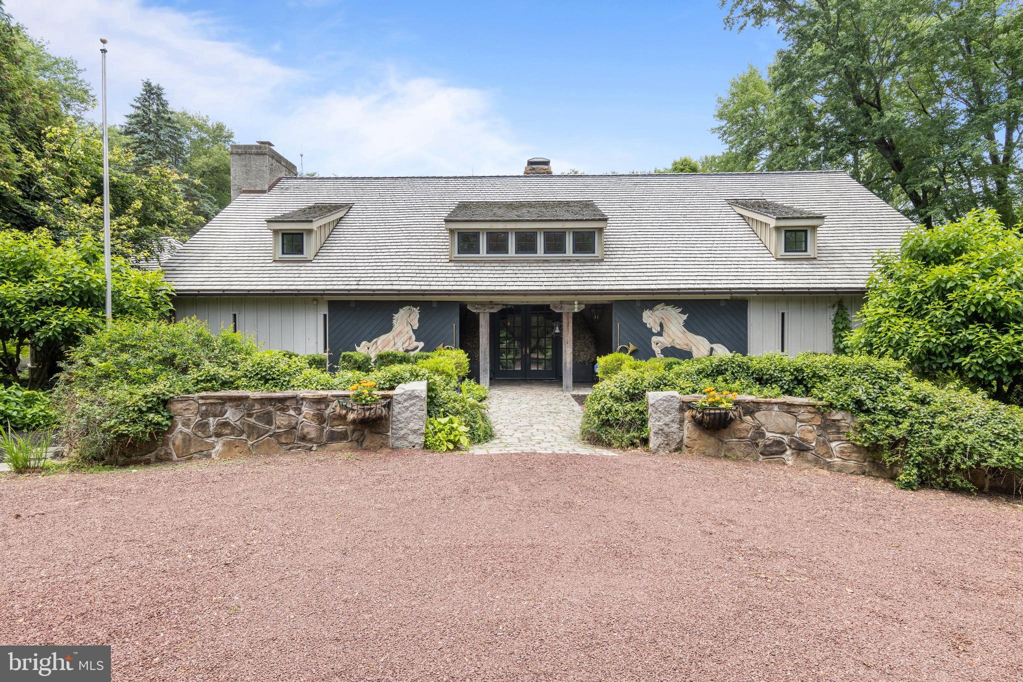 Tucked away in the heart of Radnor Hunt Country, this extraordinary estate offers a
rare blend of rustic elegance and timeless charm. Soaring ceilings, century-old barn
beams, and expansive open living spaces create a dramatic yet welcoming
atmosphere unlike any other. Thoughtfully designed, the home balances grand
entertaining areas with intimate, cozy rooms that invite relaxation and connection.
The breathtaking exterior is every bit as impressive as the interior. Set on four
picturesque acres, the property is surrounded by lush landscaping, stone terraces, a
sparkling cocktail pool, and a meandering stream, creating a private sanctuary of
unparalleled beauty. Whether hosting unforgettable gatherings or enjoying a quiet
evening immersed in nature, this remarkable property offers an exceptional lifestyle
in one of the region's most coveted settings.