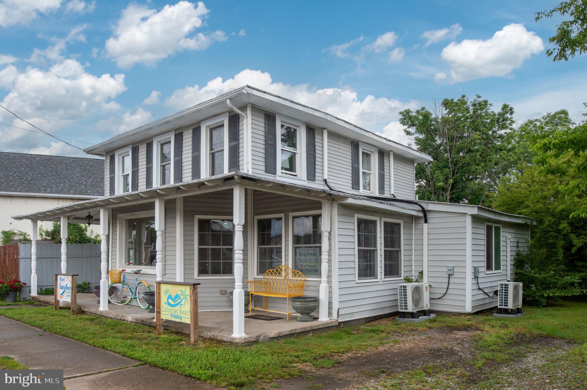 Exceptional Investment Opportunity in the Heart of Colonial Beach's Resort Commercial District!
Located just one block from the scenic Potomac River and boardwalk, this thoughtfully renovated multi-use property is perfectly positioned in the vibrant core of Colonial Beach--locally known as "The Golden Triangle."  Surrounded by restaurants, shops and year-round attractions, this prime commercial location offers unmatched visibility and foot traffic in one of Virginia's most popular waterfront destinations.
The main level features an open and flexible layout with a spacious office area, half bath, utility room, and private rear entrance --ideal for retail, office, or service use.  With renovation potential, this level could be converted into a 2-bedroom residential apartment complete with a full kitchen and laundry room.
Upstairs, a private-entry apartment includes a living room, full kitchen, dining area, bedroom and full bath -- perfect for long-term rental, short-term vacation use or owner occupancy.
The property is currently leased to the Town's Chamber of Commerce, and that lease will convey with the sale, providing immediate income for investors.  Don't miss this rare opportunity to own a high-visibility, income-producing property in the heart of Colonial Beach's commercial and tourism area--where small-town charm meets steady investment potential.
