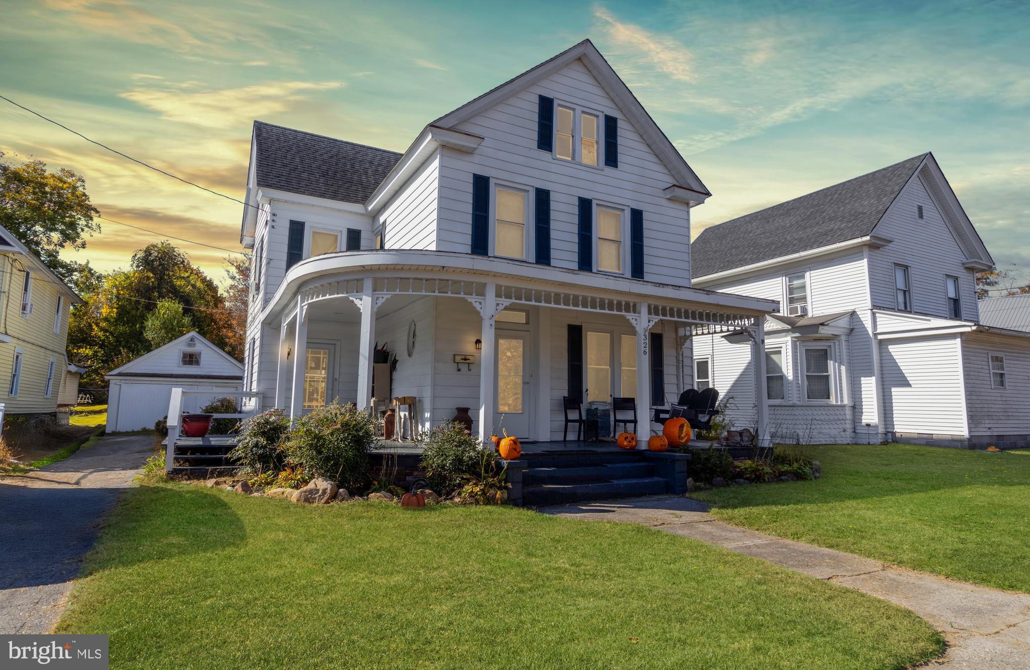 Step into this beautiful Victorian-style home featuring 3 bedrooms, 2.5 baths, and a classic freshly painted wrap-around porch perfect for morning coffee or evening relaxation. From the moment you enter, you'll appreciate the blend of old-world charm and modern touches, including a cozy den with a beautiful barn door and a wood stove that adds warmth and character. Hardwood flooring flows throughout, even beneath new carpeting upstairs, preserving the home’s timeless appeal.

Enjoy formal living spaces, a functional kitchen with new tile backsplash and pendant lighting, and a convenient laundry room with an adjoining half bath - highlighted with fresh paint. Upstairs, you'll find all three bedrooms and a full bath, plus an unfinished walk-up attic with excellent potential for future expansion. Outdoors, a tree-lined backyard provides privacy, complemented by a covered patio and a detached garage. The paved parking area offers convenience for you and visitors. Ideally located near boat ramps and parks, this home offers easy access to outdoor recreation while delivering the charm and warmth you’ve been searching for!
