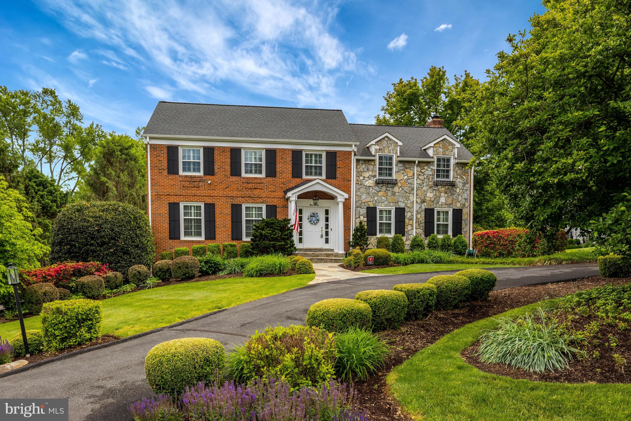 Perfectly sited on almost a half-acre in desirable neighborhood, don't miss this charming gem, with several additions over the years, that enhances the functionality of this gracious home!