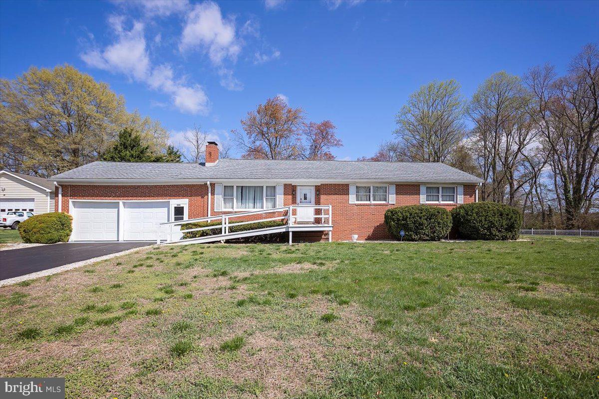 Welcome to this beautifully maintained 3 bedroom, 2 bathroom home, proudly built and lived in by the original owner. Situated on 2 peaceful acres within the town limits of Sudlersville, this property offers the perfect blend of in-town convenience and country charm. Inside, you'll find a warm and inviting layout featuring two fireplaces that add character and comfort to the living spaces. The home includes a spacious partially finished basement, ideal for extra living space, a home gym, or your dream rec room with the right touch. The kitchen includes a handy trash compactor, and the entire home is backed by a whole-house generator to keep you comfortable no matter the weather. There's a two-car garage attached as well as a detached garage with electric along with a carport—great for a car or extra storage.  Located just minutes from Route 301, this home is perfectly positioned for an easy commute while offering all the peace and privacy you’ve been searching for.