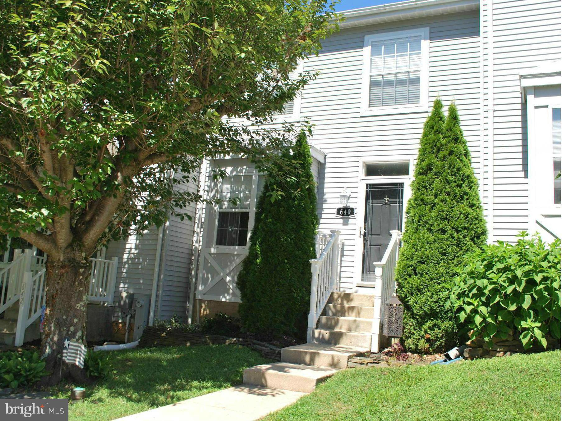 CHARMING MOVE IN READY TOWNHOUSE WITH UPDATED KITCHEN, ALL APPLIANCES, 3 FINISHED LEVELS,  BEAUTIFUL FLOORS, WOOD  BURNING FIREPLACE IN LIVING ROOM, FINISHED LOWER LEVEL WITH BAR AND A WALK OUT LEVEL, 18'X20' DECK, GREAT LOCATION WITH LOTS OF PARKING, BACKS TO WOODS