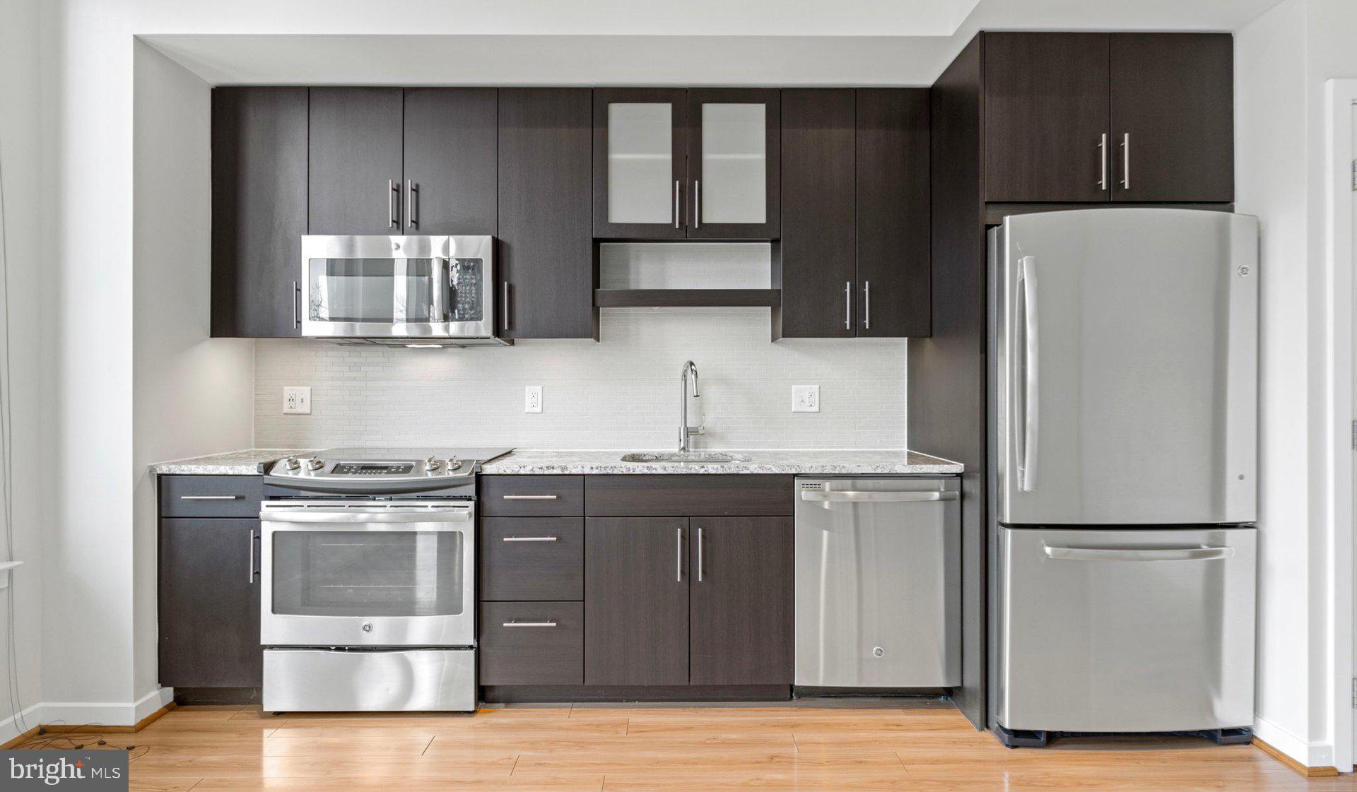 Nestled in the vibrant heart of Bethesda, Maryland, this luxury apartment complex offers an unparalleled living experience that combines modern convenience with sophisticated design. Designed to cater to the discerning tastes of urban dwellers, this property stands as a testament to luxury living, where every detail has been meticulously crafted to ensure the utmost in comfort and style.

*Exceptional Location*
Located in the sought-after Woodmont district, the apartment complex is perfectly positioned as a gateway to the best that Bethesda has to offer. Residents enjoy easy access to a plethora of amenities, including the Walter Reed National Military Medical Center, the NIH, and a variety of shopping, dining, and entertainment options. The prime location also offers convenient access to public transportation, making it easy to explore the wider metropolitan area.

*Architectural Elegance and Design*
The building's U-shaped design opens up to a beautifully landscaped courtyard, offering a seamless transition from the bustling city life to a tranquil oasis. The architecture is both richly textured and humanly scaled, creating an inviting streetscape that residents are proud to call home. A dramatic window wall façade and ground-level duplex units with front porches and planters further enhance the building's aesthetic appeal.

*Luxurious Amenities*
Residents of this apartment complex enjoy access to an array of exceptional amenities designed to enhance their lifestyle. The property boasts a large fitness center, fireside lounges, and a rooftop lounge equipped with bars, fireplaces, grilling areas, and two pools. Additionally, the convenience of having a 50,000 square foot grocery store within the building cannot be overstated. The property is also LEED Gold Certified, reflecting a commitment to environmental sustainability.

*Sophisticated Living Spaces*
The apartments themselves are a reflection of the luxury and sophistication that define the property. With a variety of floor plans, including studios, one to three-bedroom apartments, and townhomes, there is something to suit every preference. Each unit features designer finishes, stainless steel appliances, and spacious layouts that make coming home a pleasure.

*Community and Convenience*
The property is known for its friendly and helpful staff, ensuring that the needs of residents are met with professionalism and care. The well-maintained common areas and the sense of community fostered among residents make this complex more than just a place to live—it's a place to belong.

This luxury apartment complex in Bethesda, Maryland, offers an unmatched living experience for those seeking the best in urban living. With its prime location, architectural elegance, luxurious amenities, and sophisticated living spaces, it stands as a beacon of modern luxury and convenience. Realtors and renters looking for a property that combines the vibrancy of city life with the comfort of upscale living will find everything they desire and more at this premier apartment complex.

** Pricing and availability subject to change on a daily basis ** Photos are of model units ** Parking may be available for additional fee **