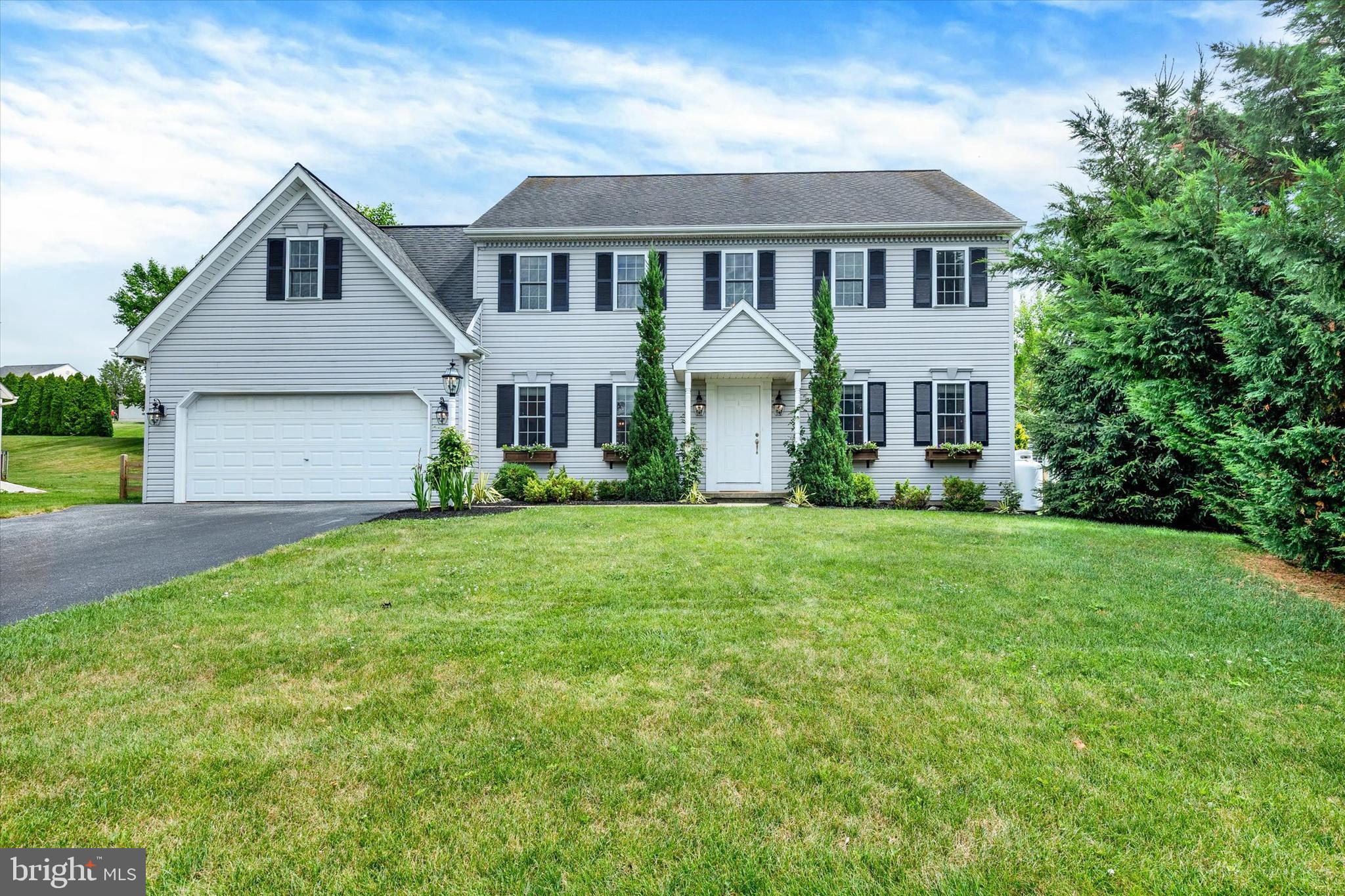 Welcome to this beautifully updated 4 bedroom, 2.5 bath colonial tucked away in desirable Witmer Estates, within the Eastern Lancaster County District. Upon entry, you'll immediately notice the rich engineered hardwood flooring that flows throughout this spacious home, offering a clean, cohesive aesthetic from room to room. The flexible, open sitting and living room is highlighted by a gas fireplace set on a stone hearth, flowing seamlessly into the bright, updated kitchen featuring a large island, subway tile backsplash, and stainless steel appliances. Just off the kitchen, the formal dining room is filled with natural light and offers a convenient wet bar with additional cabinetry — perfect for entertaining. Rounding out the main level are a powder room and walkout access to the large, lush, fenced-in backyard. Upstairs, you'll find plush, thick carpeting throughout. The sizeable primary bedroom boasts an en suite bathroom and ample closet space. Three additional spacious bedrooms and a full hall bath complete the second floor.
The largely finished lower level offers a cozy bonus space where the possibilities are endless, along with a separate utility area ideal for storage.
Peacefully situated yet just minutes from local amenities, this home truly offers the best of both worlds.
