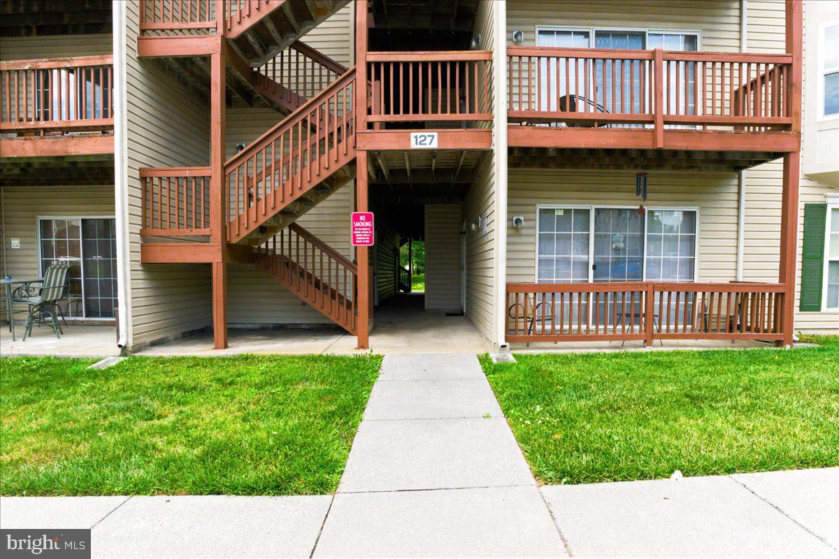 Fantastic location! This spacious second-floor condo offers vaulted ceilings, generously sized rooms, and a bright, open feel throughout. Enjoy relaxing on the private deck overlooking the common area and mature trees. The floor plan features a large living room, separate dining room, two spacious bedrooms, and two full bathrooms. The primary suite includes a private bath, a large closet, and plenty of space for a king-sized bed. A separate laundry room with a full-size washer and dryer adds everyday convenience.