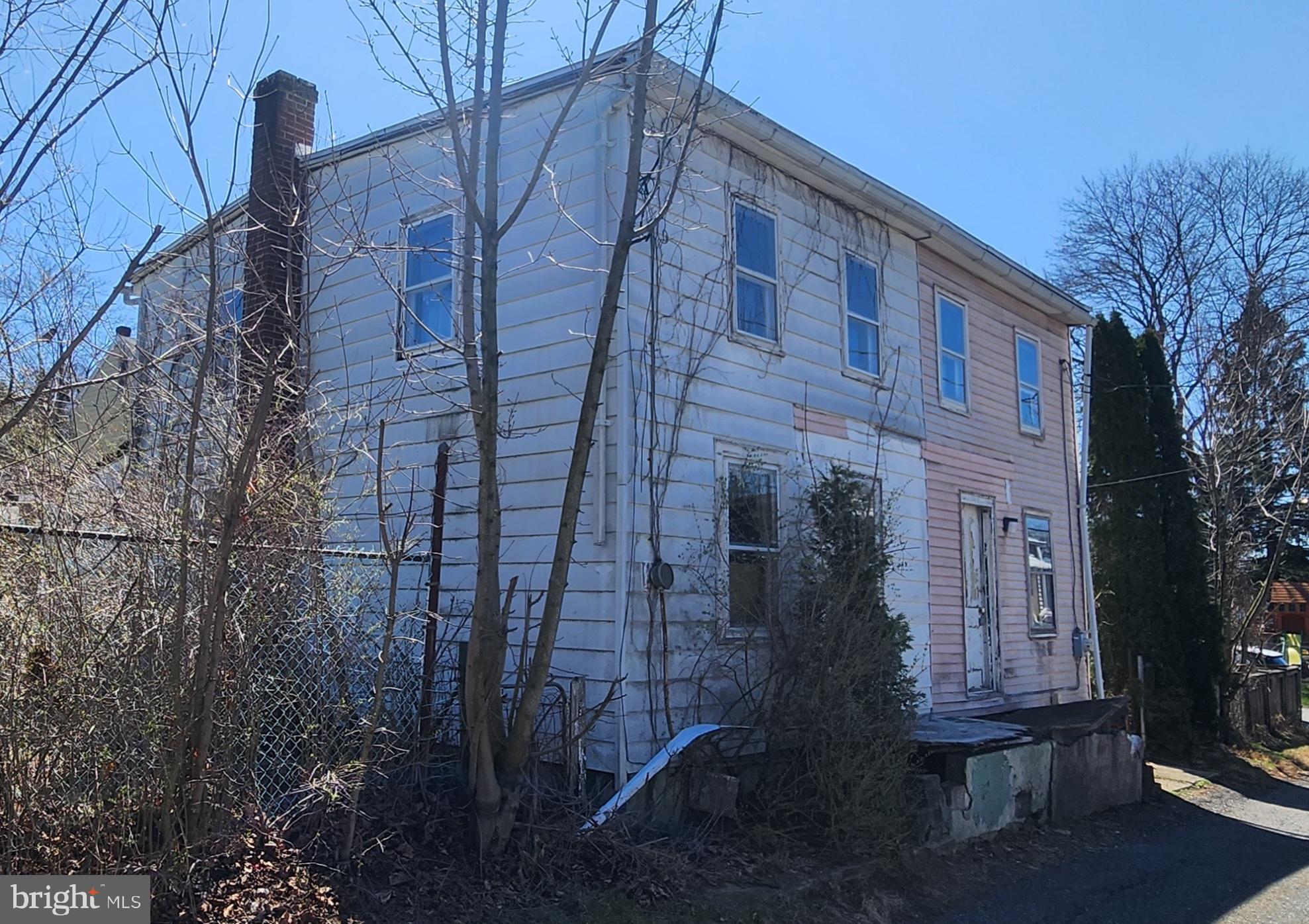 This double home needs to be completely refurbished. You can put everything NEW into this double home or convert it to one larger single. Cash sale only and buyer must remove remaining items from home.