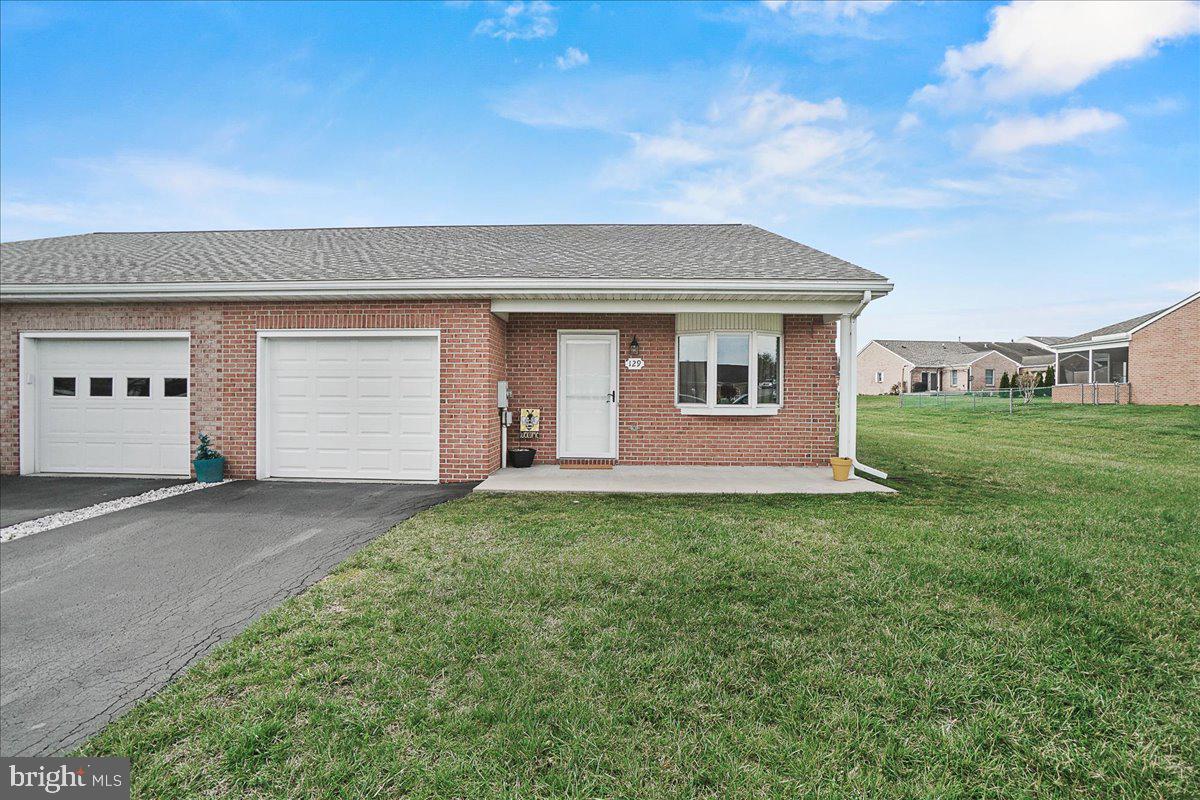 Welcome to 129 Buttercup Drive.  This home shows pride of ownership throughout. If you are looking for a home with a great location that offers an easy commute, near shopping and dining -look no further.   Inviting open floor plan features a large kitchen filled with cabinets and a sunroom that leads to a patio.  A great place to entertain your family and guests.  A newer roof with a transferable warranty and a brand new insulated garage door. Fresh paint throughout!  All you need to do is move in.