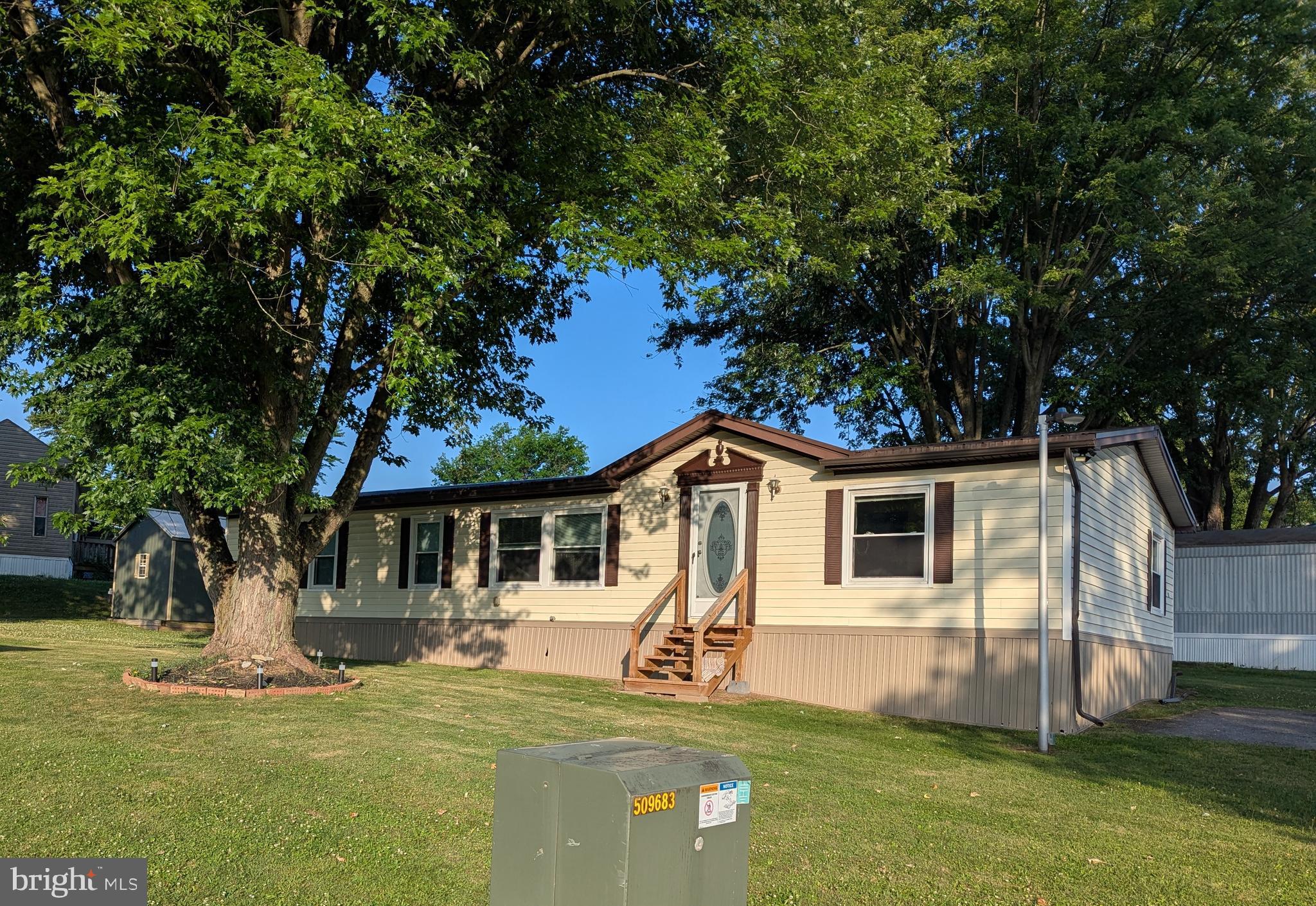 This well maintained doublewide mobile home has a newer metal roof installed just three years ago, new flooring in the kitchen and living room, remodeled kitchen, and remodeled bathroom to include walk-in shower.  The shed has electric and the mobile has 200 AMP service.   This home is nestled in the beautiful Pleasant View Mobile Home Park.  Ground rent is $435 a month.  Tenant also pays water ($62.95 per quarter up to 5000 gallons), sewer ($97.87 per quarter) and trash ($17.56  per month).  No dogs allowed, but you can have up to two cats.  Buyer must be park approved. Square footage and room sizes are approximate.