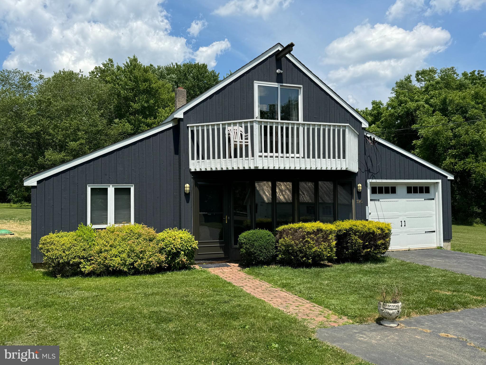 Carriage House rental overlooking 15 acres! First floor includes a living room with a wall of windows overlooking the grounds. Windows are Pella with built in blinds. Newer wall-to-wall carpeting. Kitchen has new dishwasher, refrigerator, stove (microwave to be replaced).  Also on the first level are a full bathroom with tub/shower combination, bedroom, and double laundry closet with new washer and dryer provided. The upstairs bedroom features sliding glass doors to a deck. The main bathroom has a stall shower. A huge garage (25' x 12') is connected with inside entrance to the living room area. Well water and new public sewer. FIOS installed. No lawn maintenance required!!! Stairs to the second floor are a turned staircase with small treads at the top (Please use caution when using the staircase).