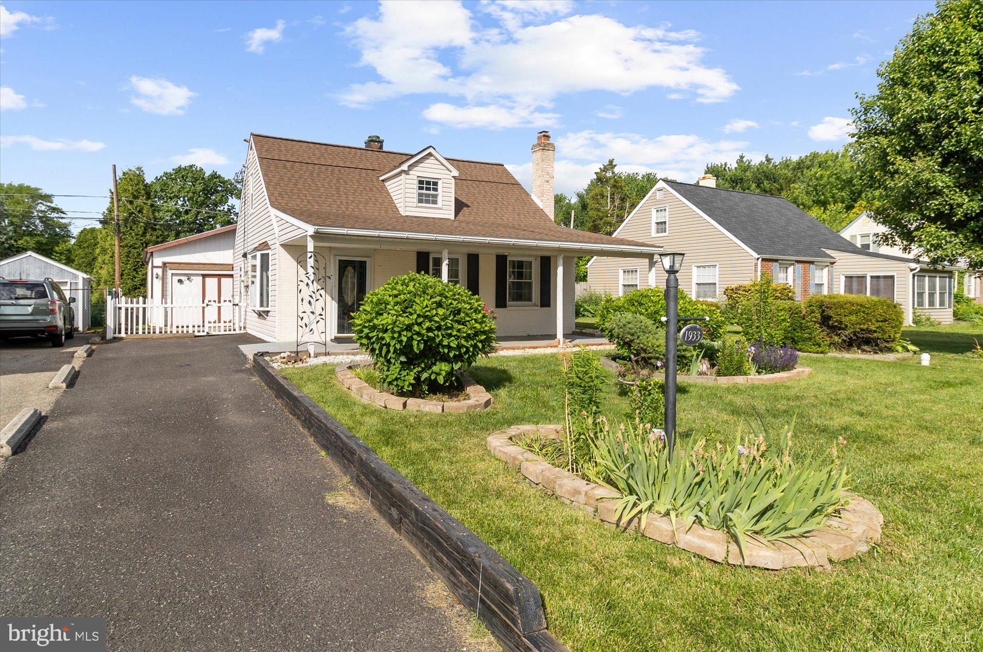 Looking for a home that checks boxes? This updated Cape Cod might be the one! Featuring a cozy fireplace, updated kitchen, first-floor bedroom, full bath, and convenient first-floor laundry, this home offers comfort and flexibility from day one. And wait until you see the detached 2-car garage—currently set up as a woodshop, but the possibilities are endless! Hobby space, home mechanic's garage, workshop, gym, studio... you name it. And with no HOA, you have even more freedom to make the space work for your lifestyle. Plenty of driveway parking, a fenced backyard with a fire pit, beautiful flower beds ready for your personal touch, and two great outdoor spaces—a large covered front porch and a sunny patio off the kitchen.Tucked away in the back of the neighborhood, this home offers the perfect blend of privacy, charm, and potential while still being conveniently located near parks, shopping, the zoo, and other local entertainment. Best of all? Settle in time to spend the summer making it your own!