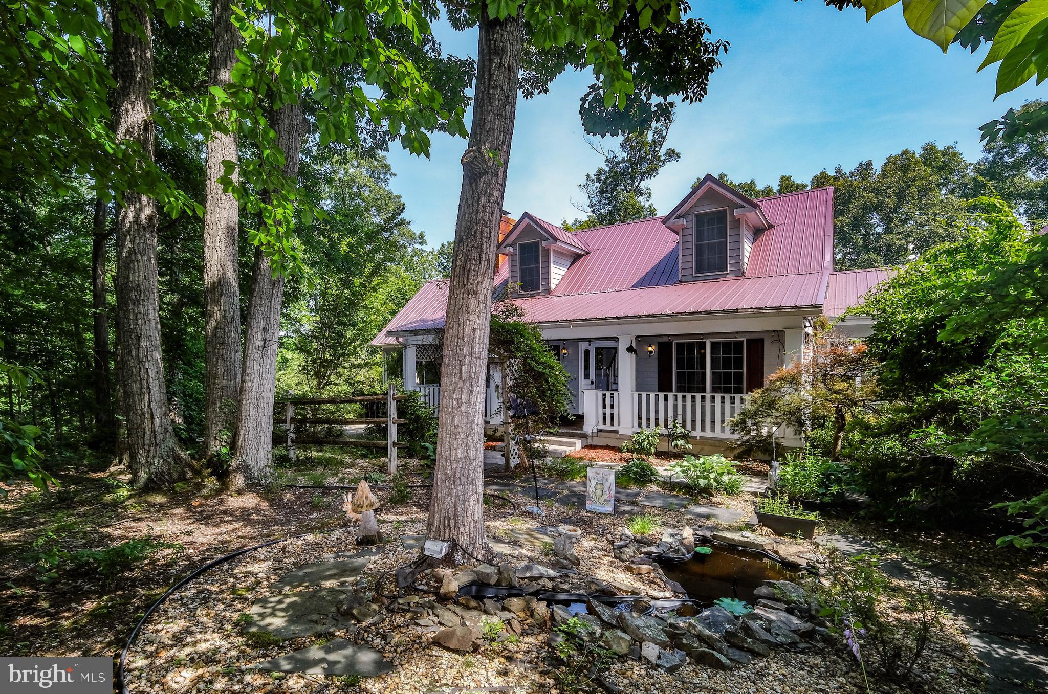 Assessed at 635k, buyers will have immediate equity at this view-filled, over 3,700-square-foot private getaway in Green Hill Forest located just minutes from Interstate 66 and the Town of Front Royal. On SEVEN private acres with MOUNTAIN VIEWS and TWO STREAMS on the property, this home is perfect for nature watching, hunting, and enjoying peace and quiet. 

Enjoy the MAIN LEVEL MASTER with vaulted ceilings and a large bathroom with a skylight, AND a walk-in closet with built-ins. With upgraded granite countertops in the kitchen, high ceilings throughout the main level, and recessed lighting, this home is quite the catch. The main level offers a large living room (with a fireplace insert), sunroom, a dedicated dining room/additional living room, a dedicated laundry room, and a breathtaking open 23' x 14' kitchen. Additionally on the main level, a 1,000 sq. ft. deck with UPGRADED TREX and a conveying sun setter create the perfect spot to enjoy nature and soak in the MOUNTAIN VIEWS. The Trex deck and new modern railings include steps to access the rest of the property and backyard. 
<br><br>
Walk upstairs under the second SKYLIGHT to the upper-level that includes a full bath with tile flooring and mountain views, as well as two mirror 14' x 13' cape-cod style bedrooms with walk-in closets and mountain views. 
<br><br>
The lower-level features approximately 1163 finished square feet, and includes a large bedroom with a walk-in closet, as well as a large, finished area and bump-out that the seller used as an office space. The basement also has a bonus half bath with a rough-in for a shower/tub, a large unfinished room (with built-in shelves that convey), offering a surplus of storage. Stay warm in the winter with a working wood stove. Walk out of the main area through sliding glass doors onto a sheltered upgraded Trex patio.
<br><br>
The koi pond, additional concrete patio, fireplace, and HUGE front porch make this outside space extremely lovely. This house is surrounded by trees, vegetation, and mature landscaping, making the privacy that it offers unbeatable. The sellers also recently paved the driveway with asphalt, and the driveway has a bump out/back up area for an extra parking space. The storage that this home offers overall is incredible, with loads of storage in the main home as well as a large storage area above the attached garage. Come see this beautiful retreat before it is too late.