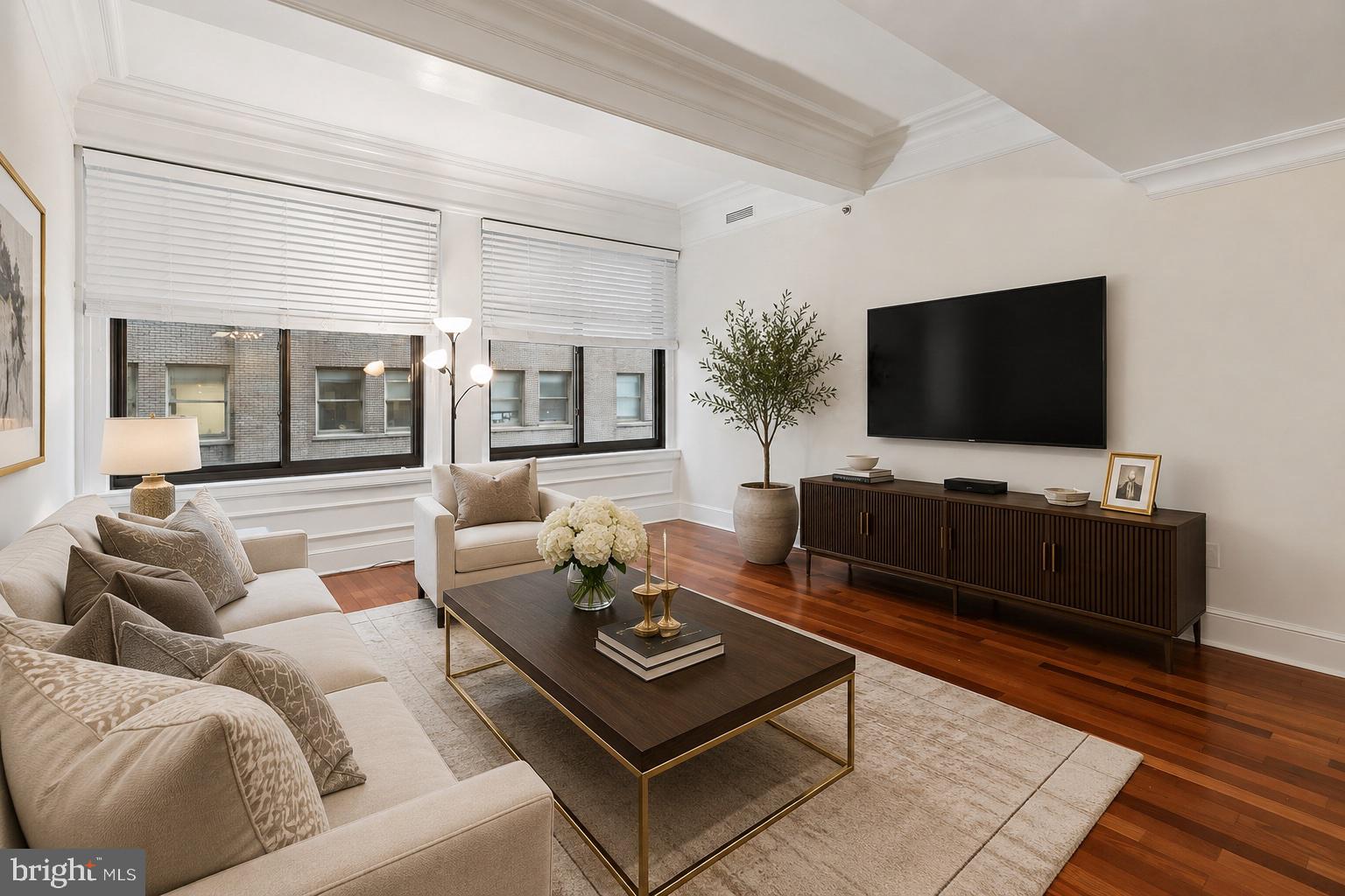 Enjoy space, comfort, and luxury at the award-winning Ellington! - This oversized 845 square foot one bedroom residence has been exceptionally upgraded and features designer finishes, custom woodwork, and ample closet space. The living and dining areas offer dramatic ten foot high ceilings, oversized windows, and Brazilian hardwood floors. The gourmet kitchen showcases high-gloss lacquer POGGENPOHL cabinets, stainless steel appliances and a convenient breakfast bar. The bedroom is generously proportioned and has been masterfully designed to boost sleek custom built-ins and closet organizers. The spacious spa-like bathroom showcases white GIOIA marble tile flooring, designer fixtures and a ceramic sink with storage vanity. A multitude of discerning upgrades - including custom moldings and millwork, designer lighting, and custom blinds - complete this one-of-a-kind residence. Included in the association fees are central air and heating, water and sewer, 24 hour concierge, private fitness center and club room. This pet-friendly residence is ideally located in the prestigious Rittenhouse and Avenue of the Arts district, just steps from fine dining, unique shopping, world-class cultural attractions, and vibrant nightlife. With easy access to Penn and Drexel campuses, 30th Street Station, and major hospitals, this home offers unparalleled city living in one of Philadelphia's most sought after neighborhoods.